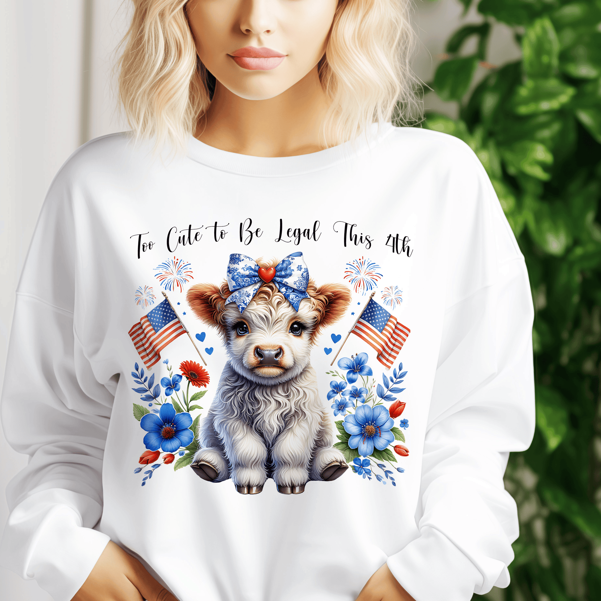 a woman wearing a white shirt with a cow on it
