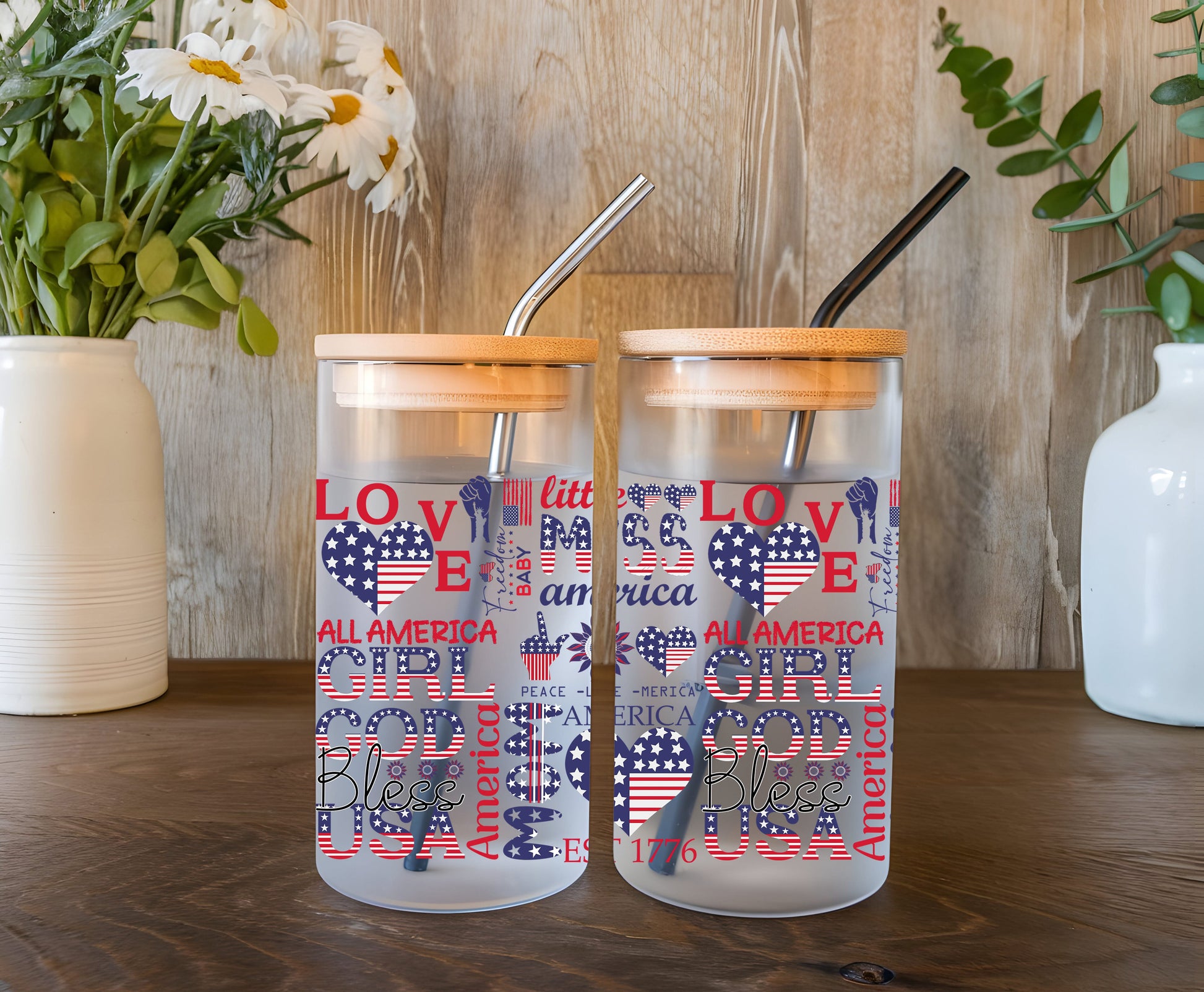 a couple of tumblers sitting on top of a wooden table
