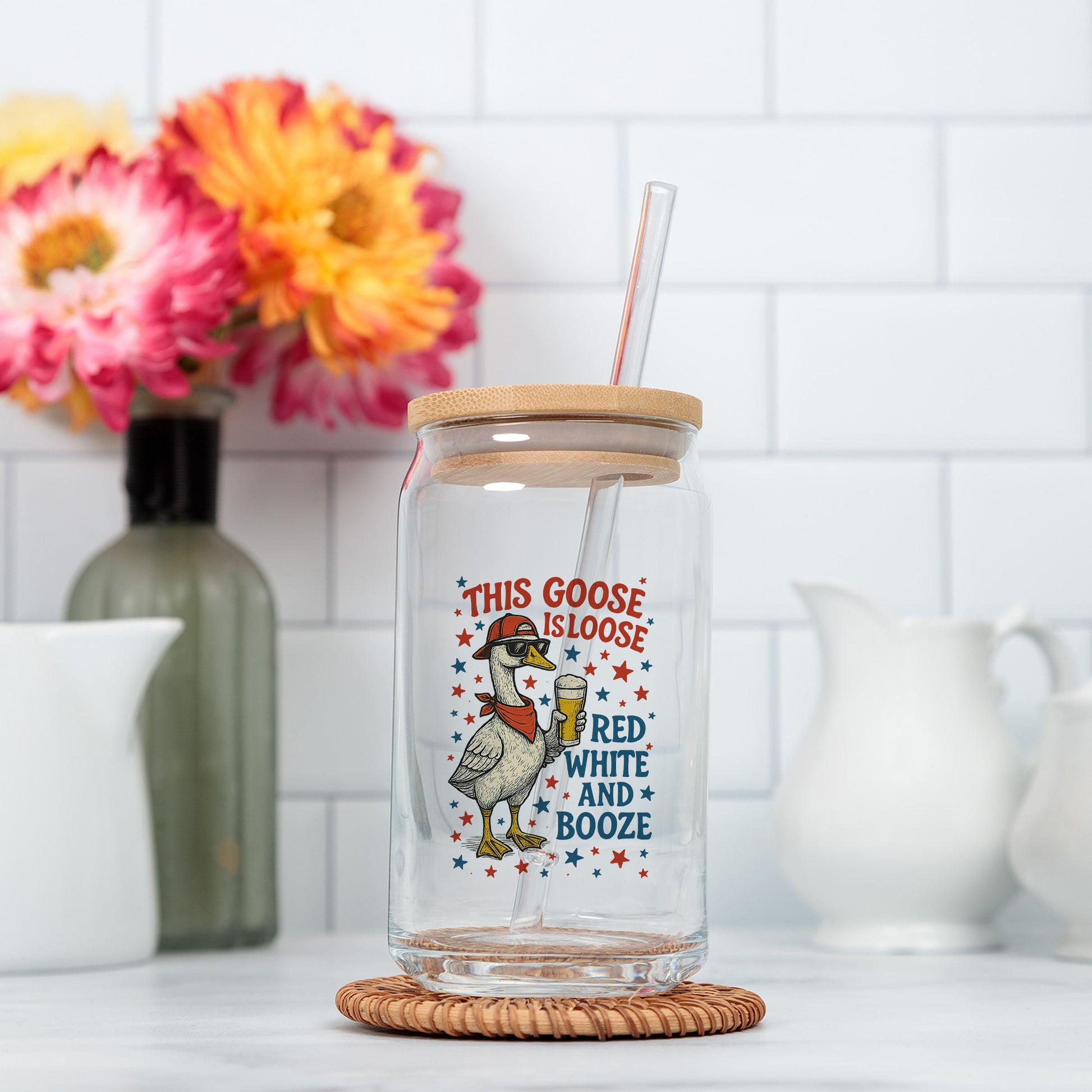 a glass jar with a straw and a straw in it