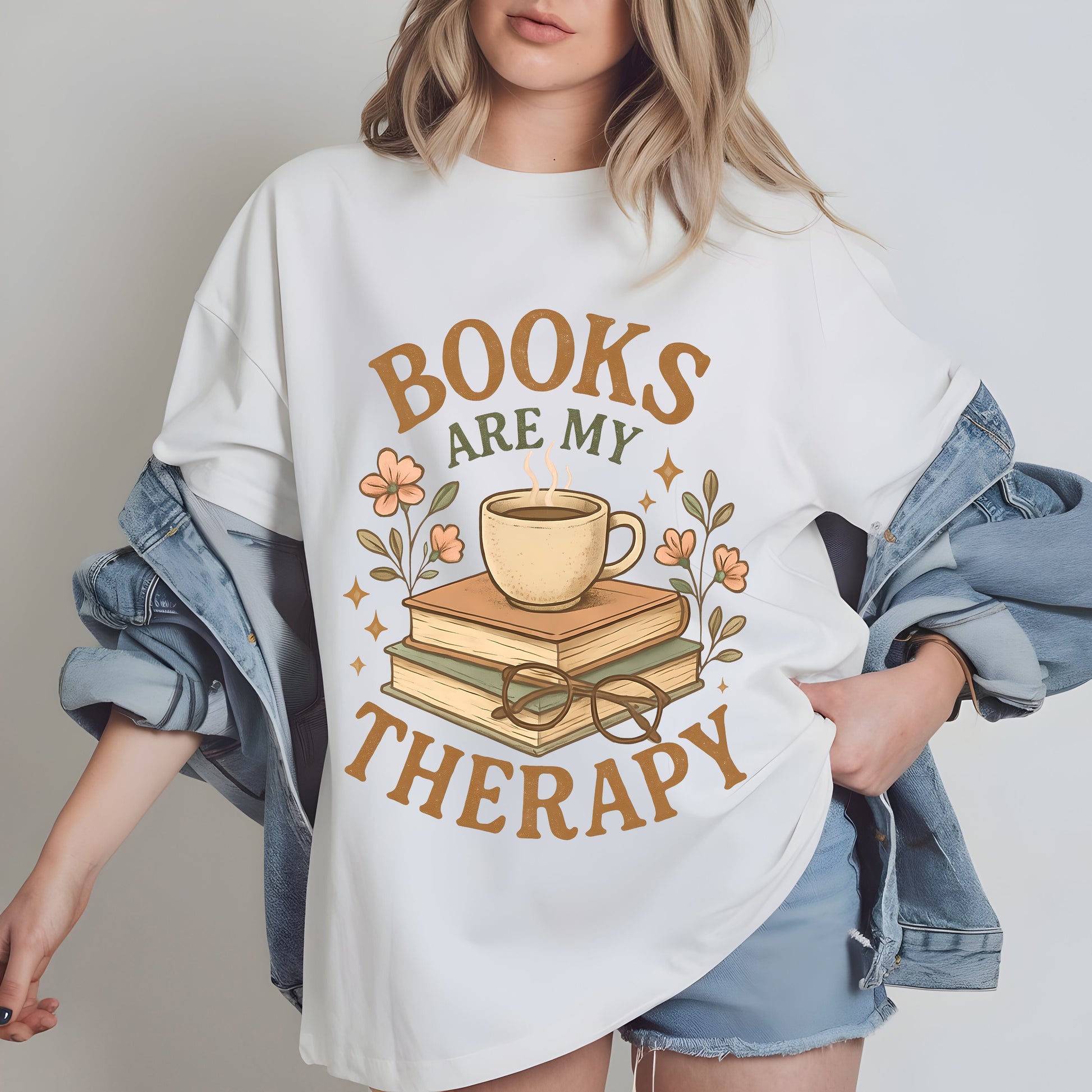 a woman wearing a t - shirt that says books are my therapy