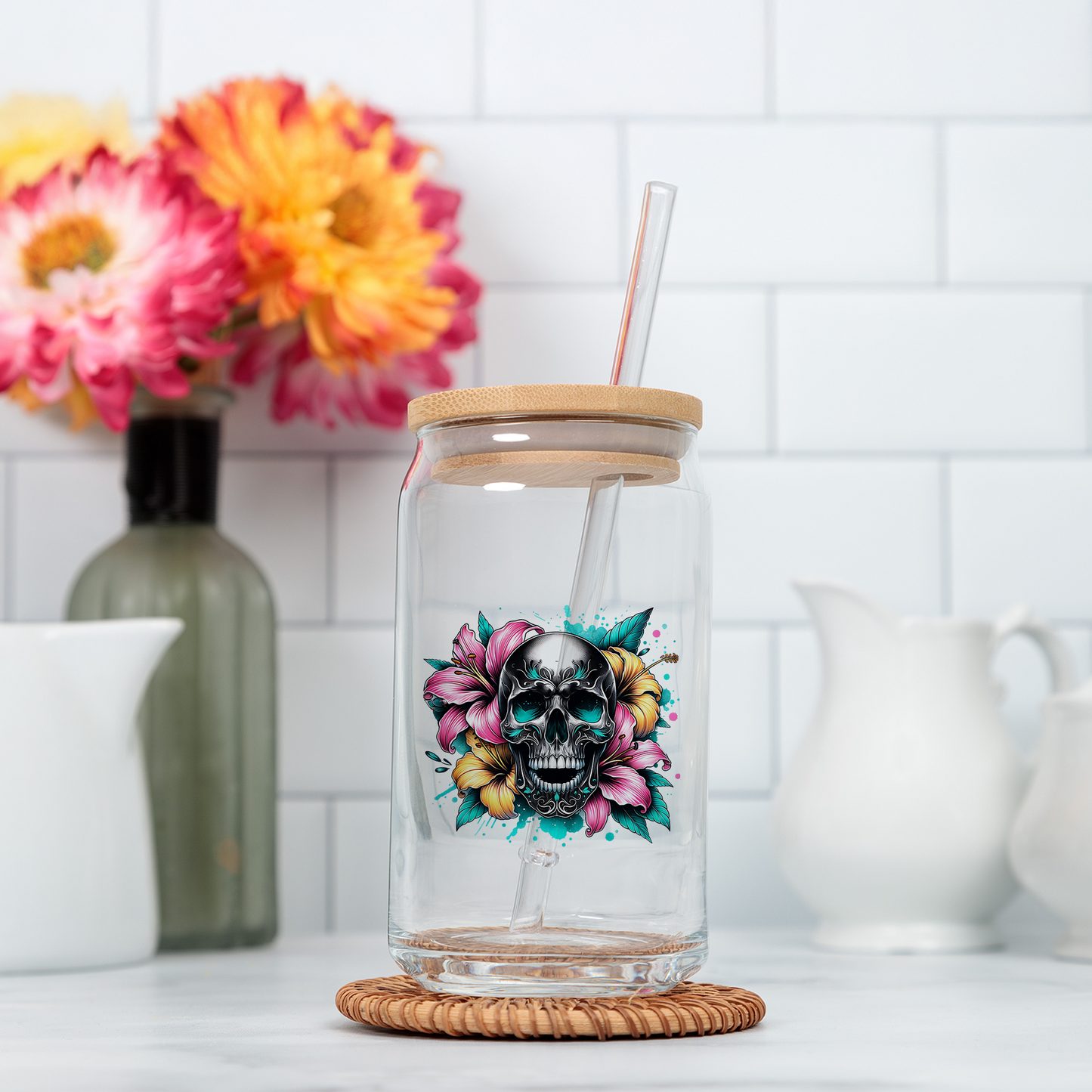 a glass jar with a straw and a skull on it