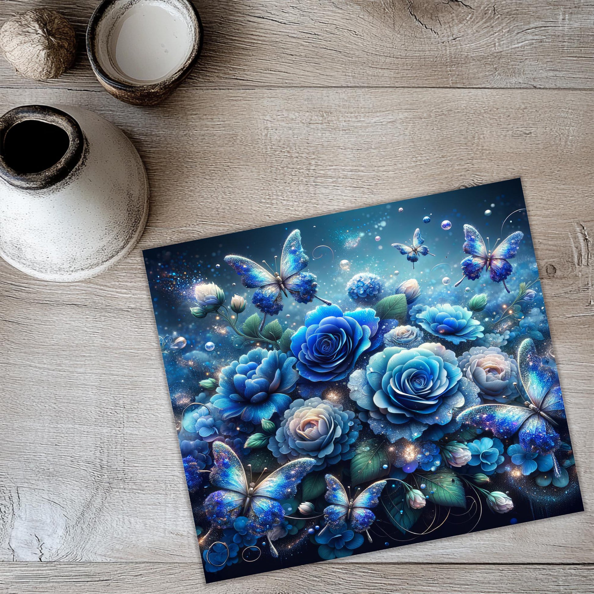 a painting of blue roses and butterflies on a table