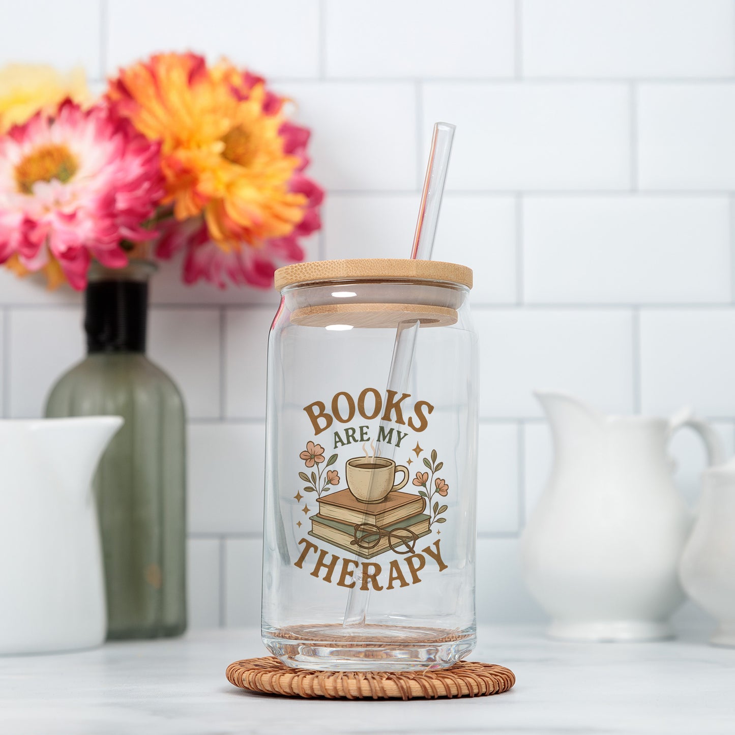 a glass jar with a straw in it sitting on a counter