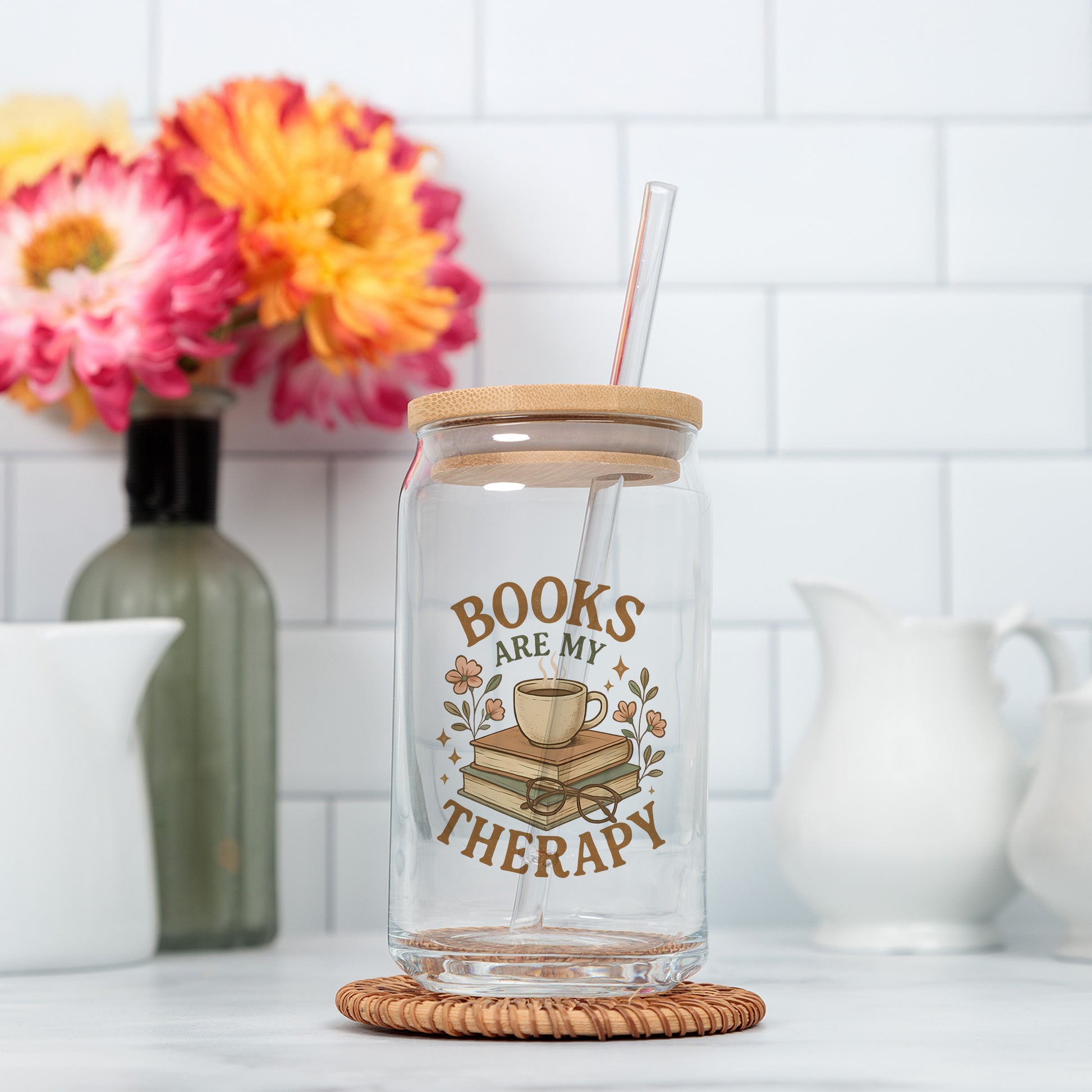 a glass jar with a straw in it sitting on a counter