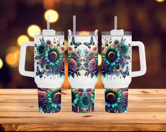 three travel mugs with floral designs on them