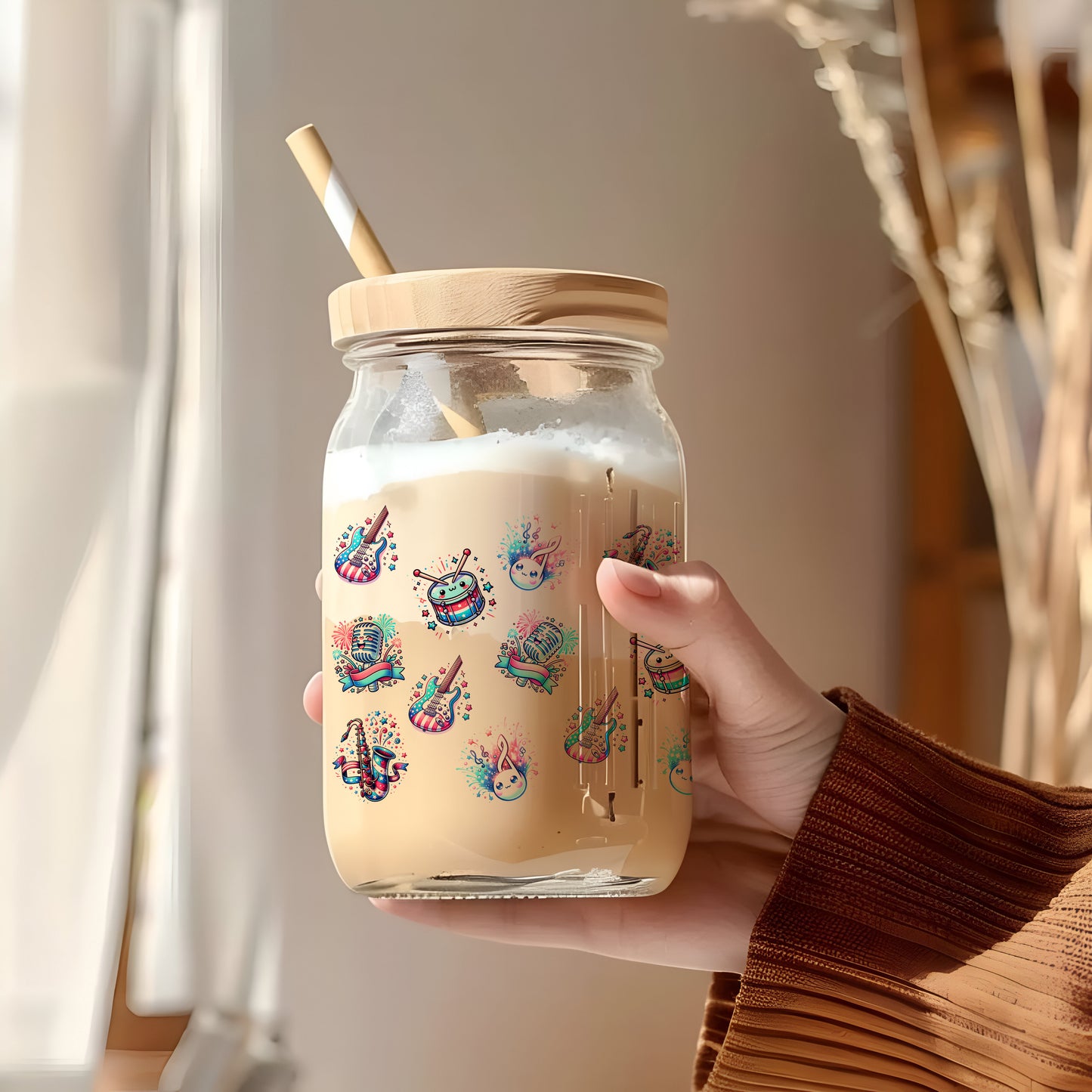 a person holding a jar with a straw in it