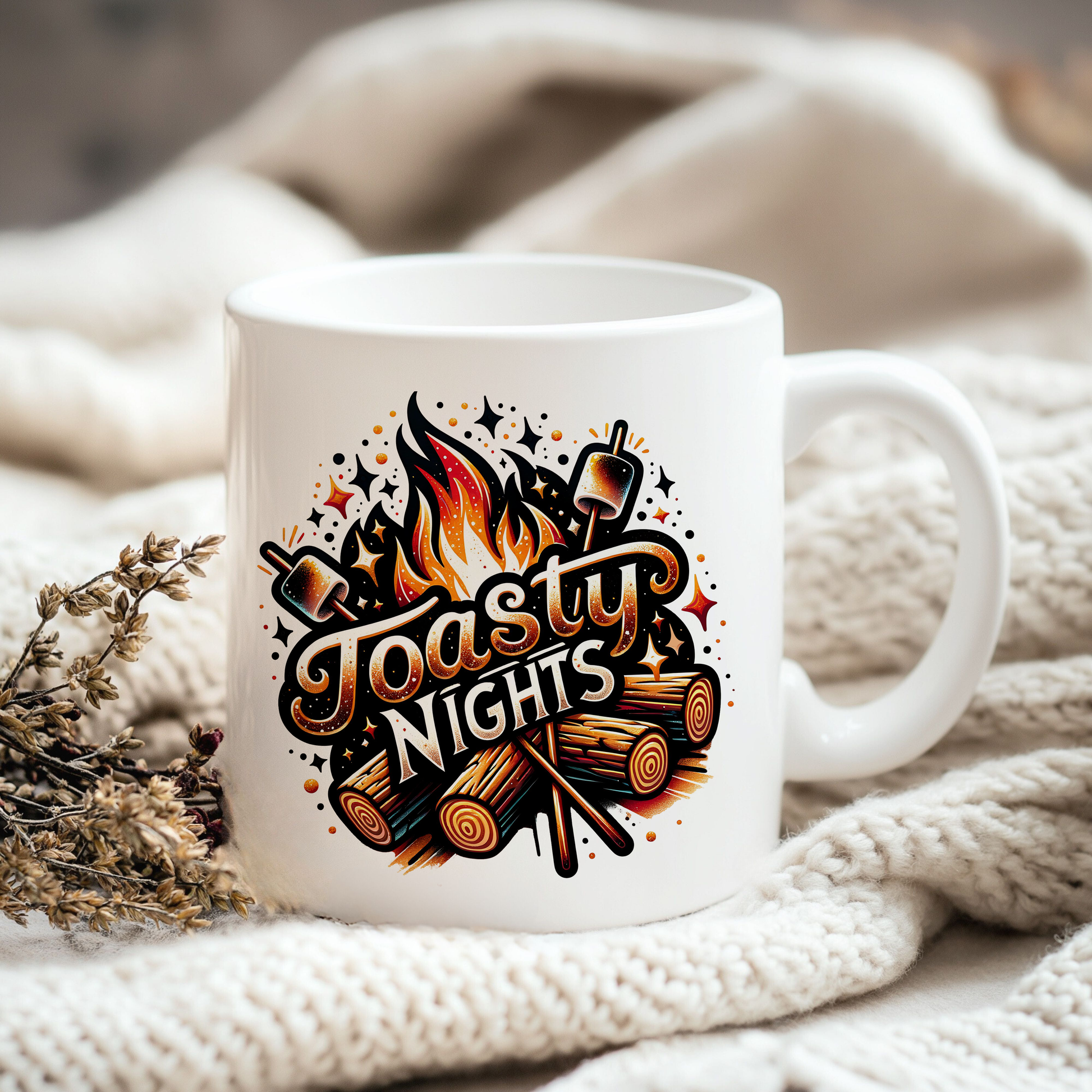 a white coffee mug sitting on top of a white blanket