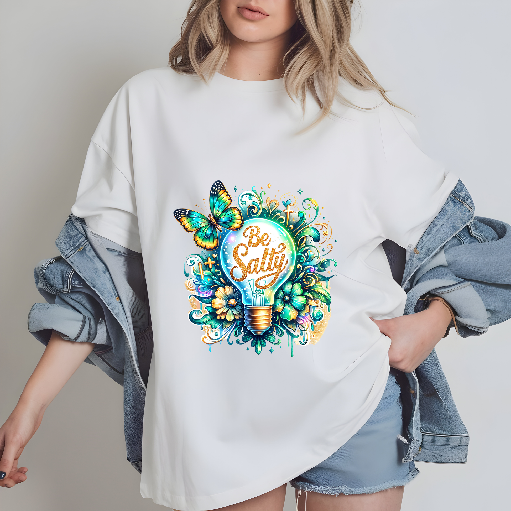 a woman wearing a white t - shirt with a light bulb and butterflies on it