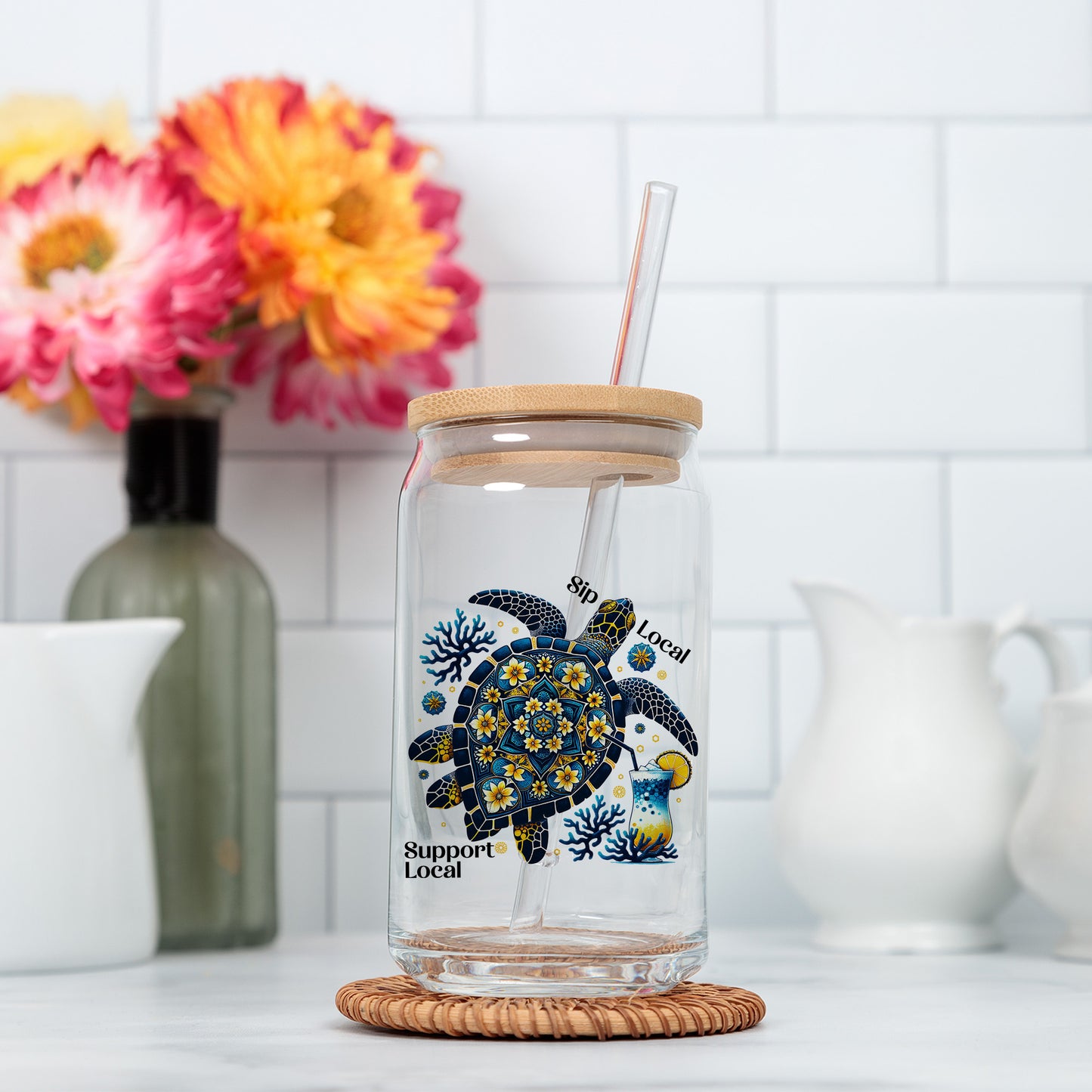 a glass jar with a straw in it sitting on a counter