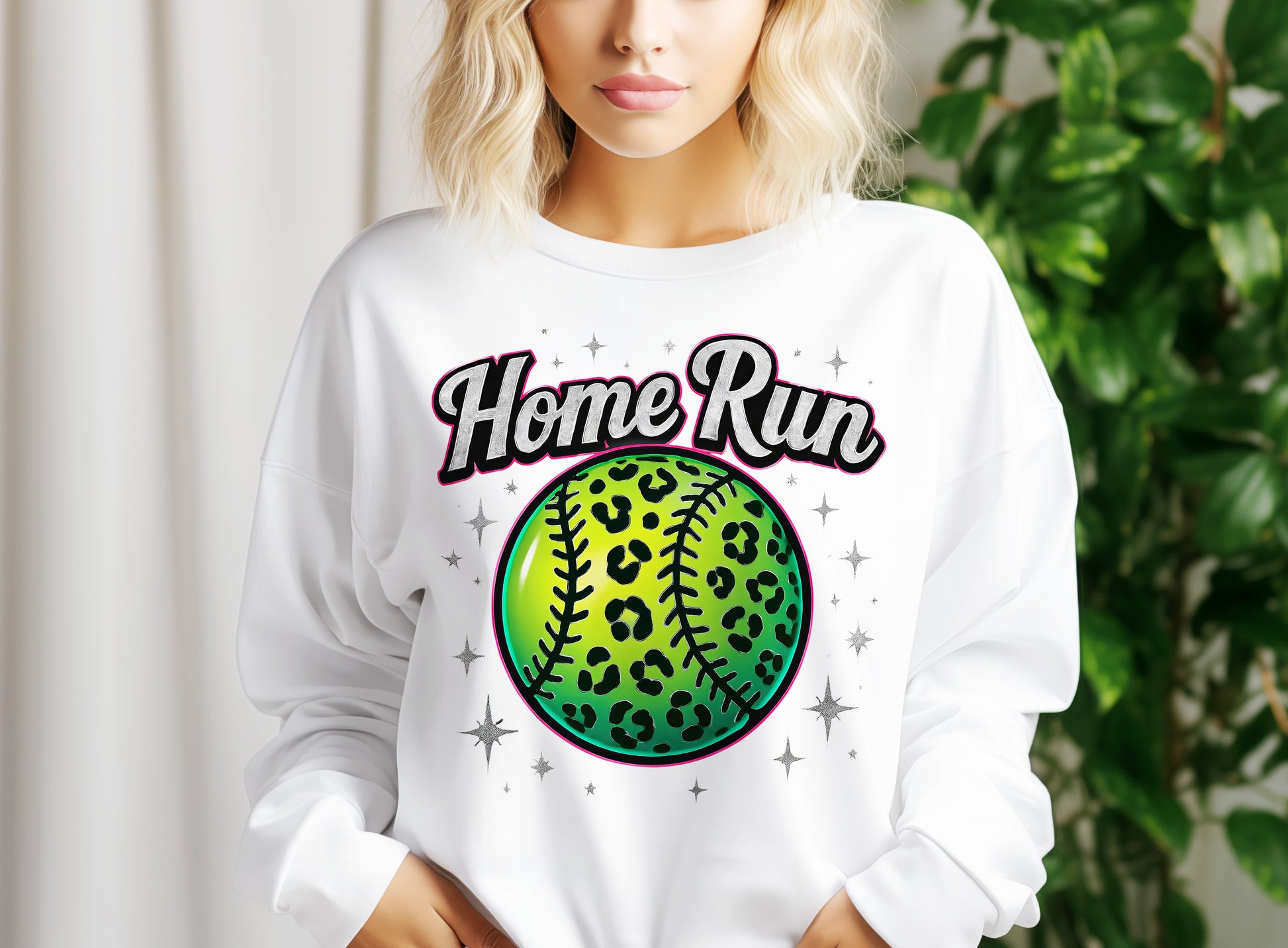 a woman wearing a white sweatshirt with a baseball on it