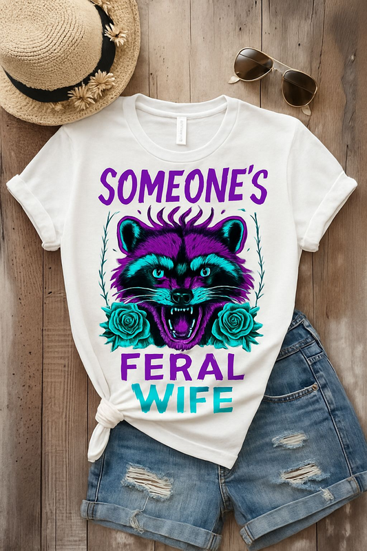 a t - shirt that says someone's feral wife with a racco