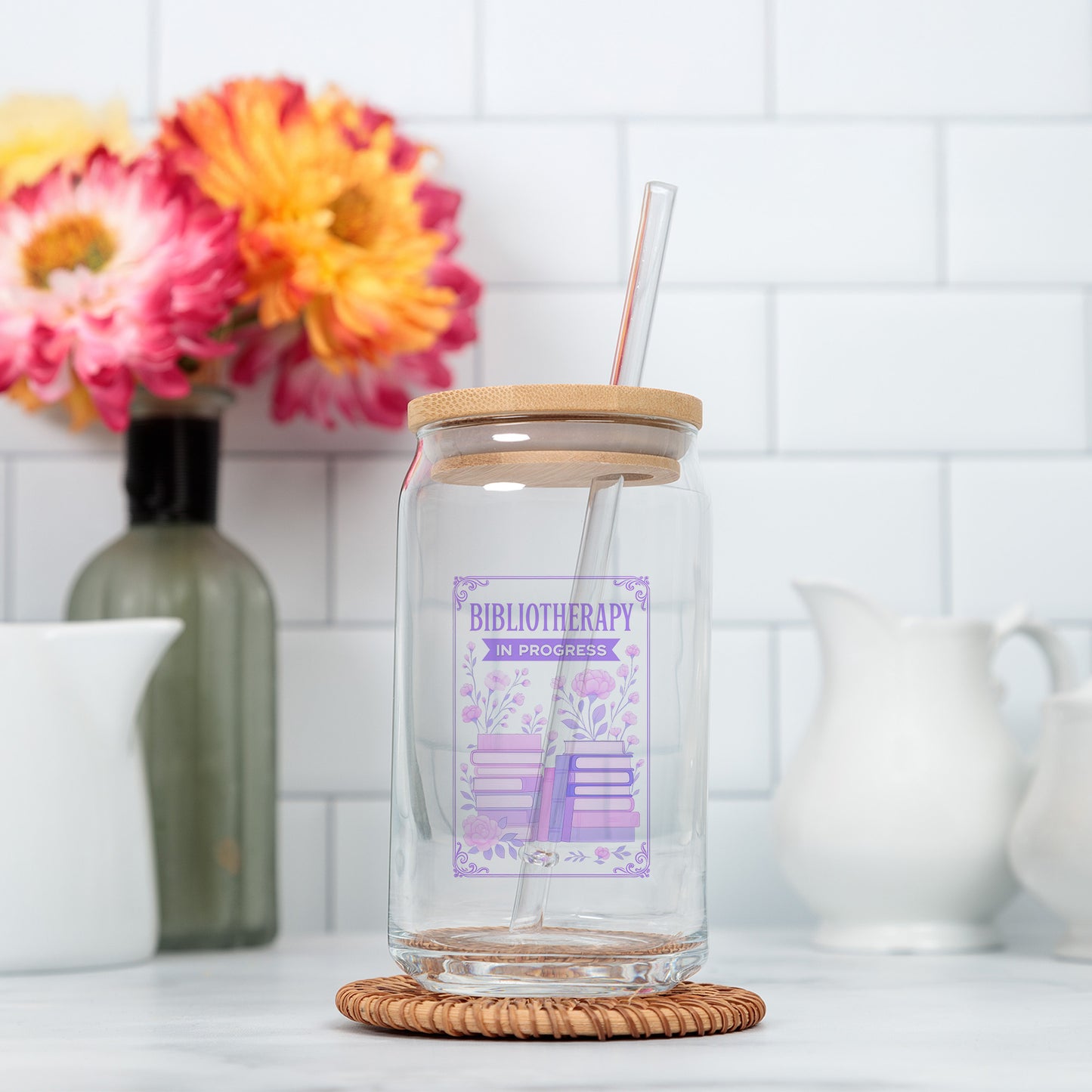 a glass jar with a straw in it sitting on a counter