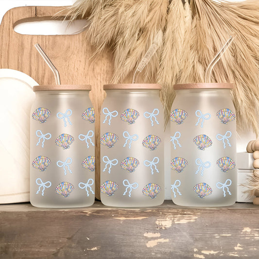 a couple of cups sitting on top of a wooden shelf