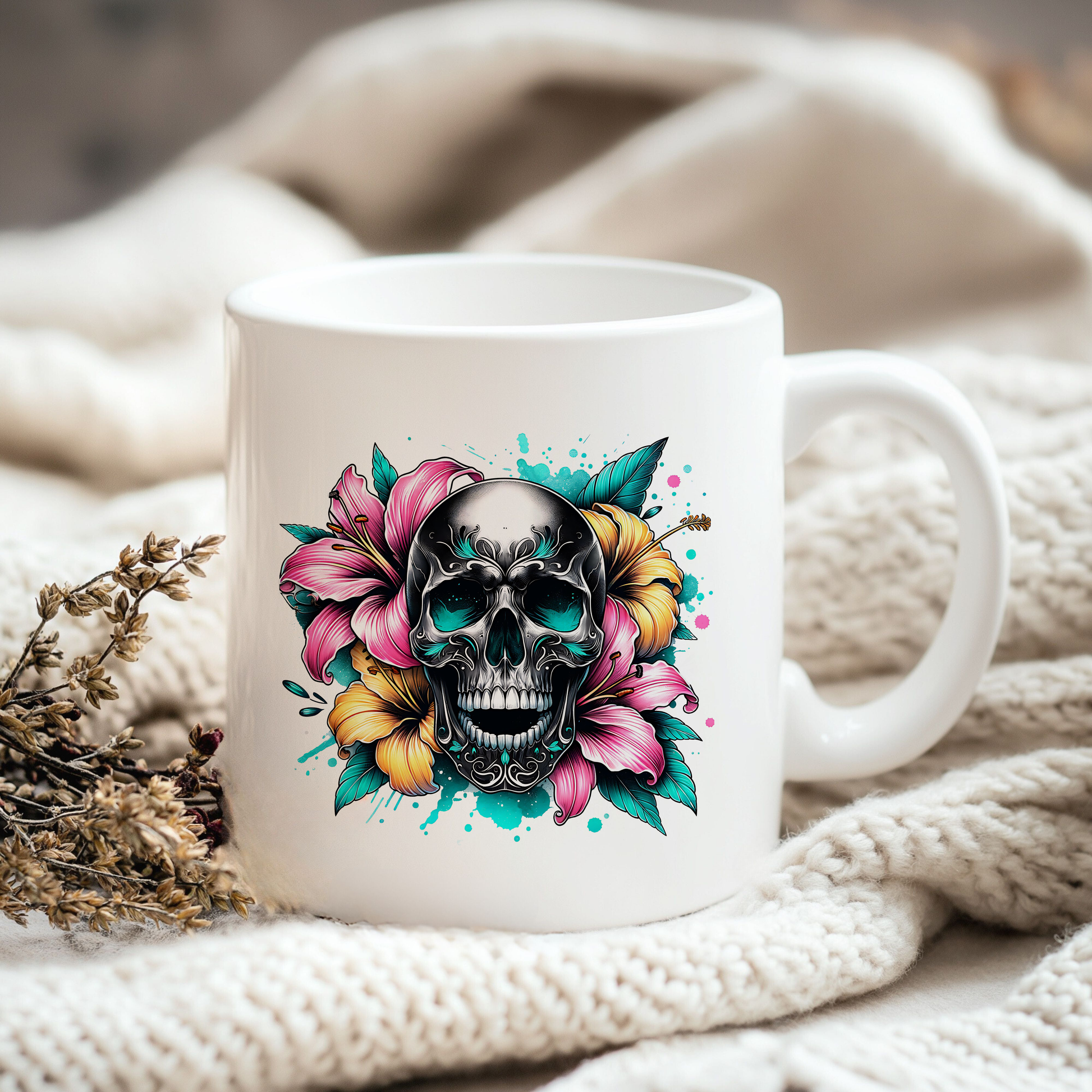 a coffee mug with a skull and flowers on it