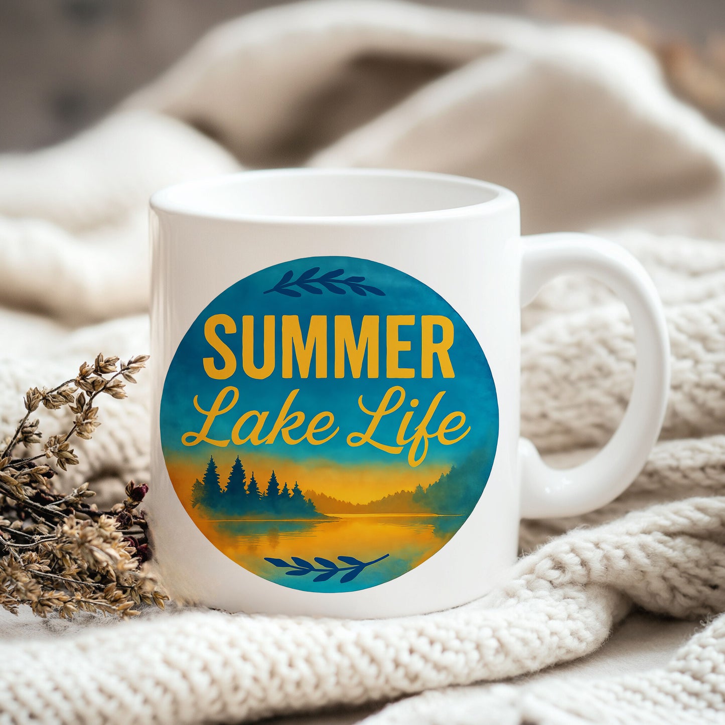 a coffee mug sitting on top of a blanket