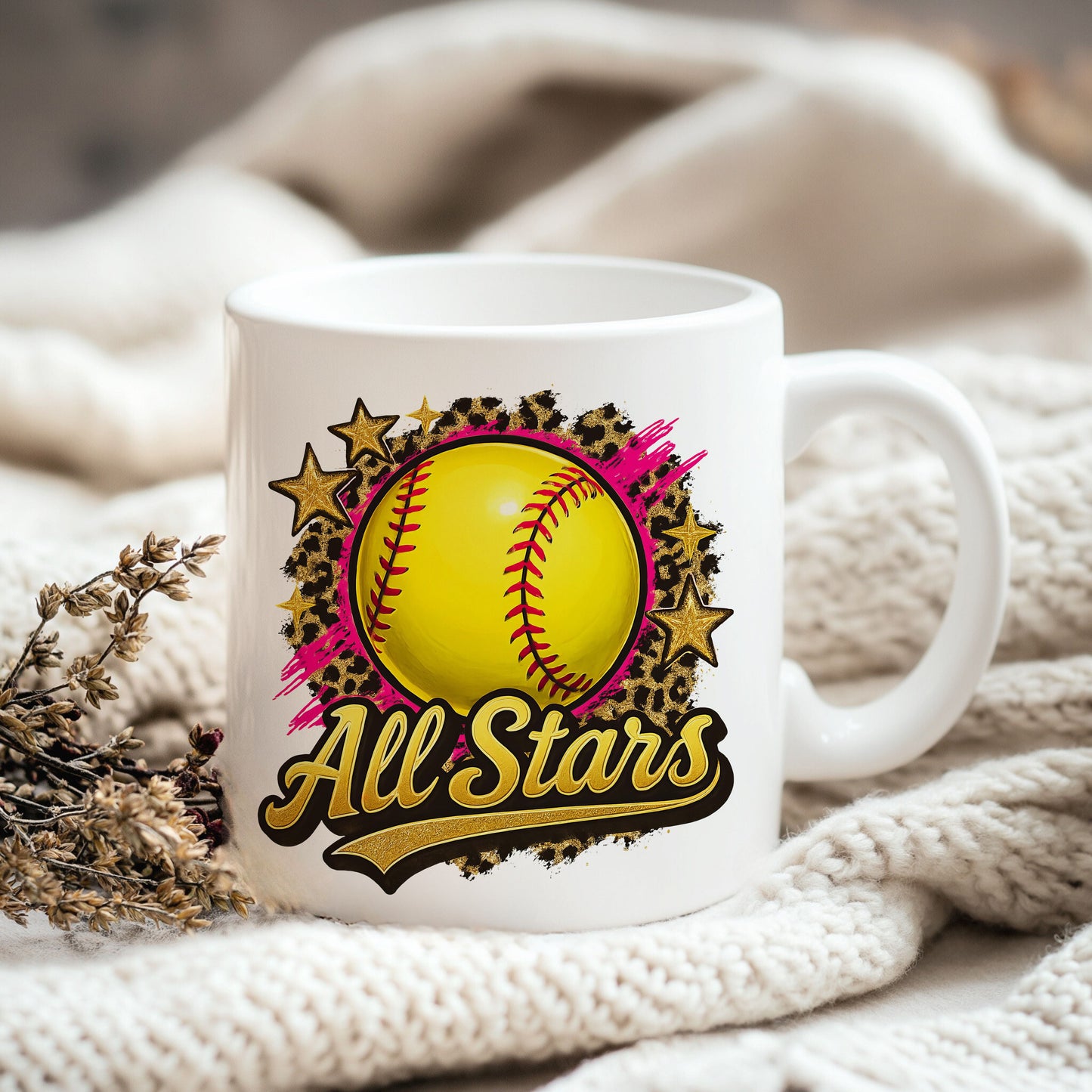 a white coffee mug with a softball on it