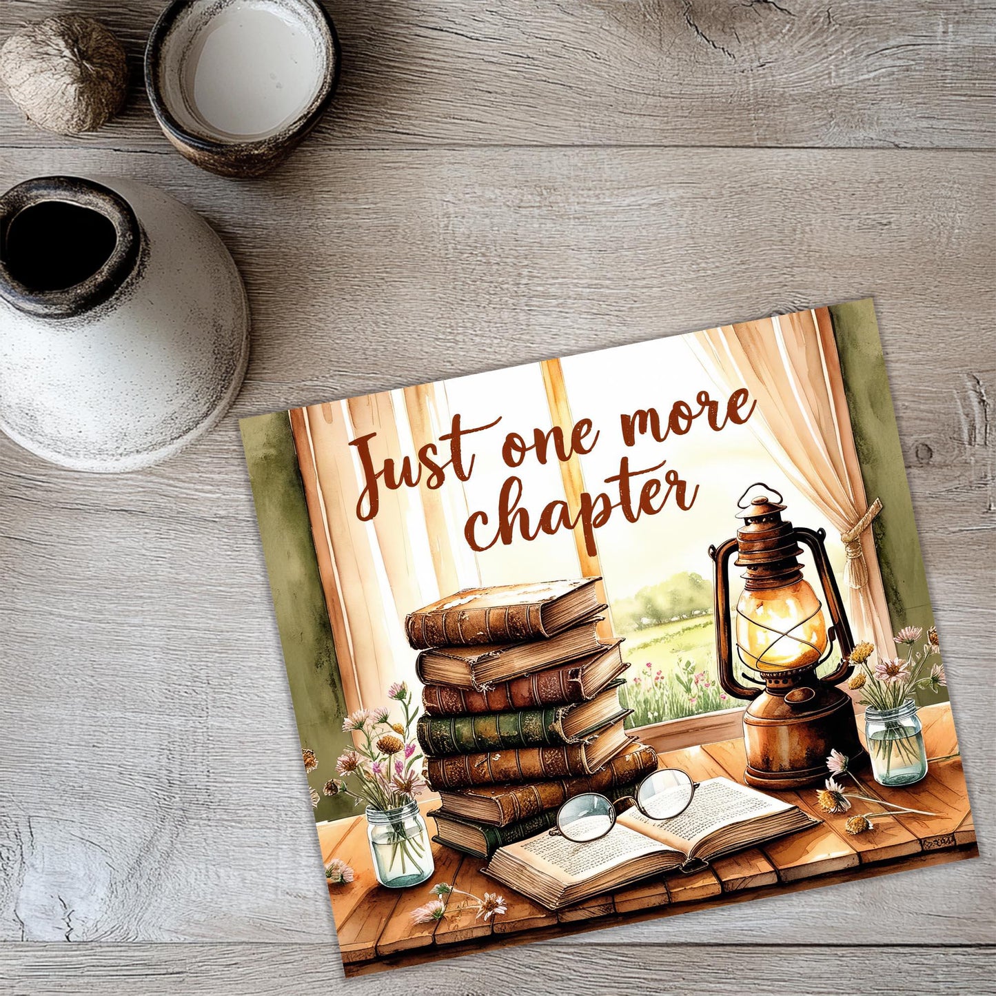 a card with a picture of a stack of books and a lantern