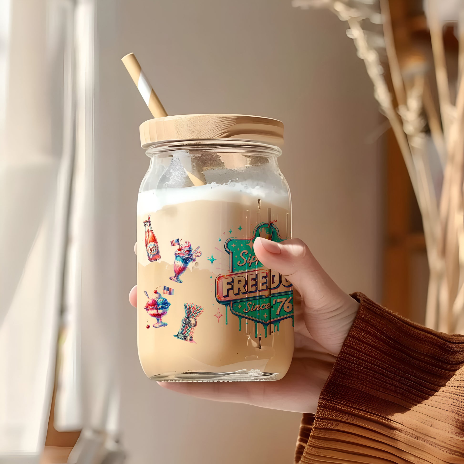 a person holding a jar with a straw in it