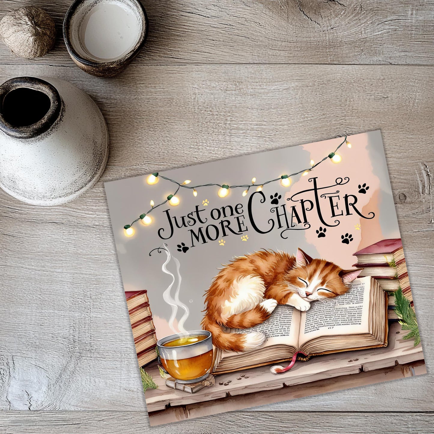 a picture of a cat sleeping on top of a book