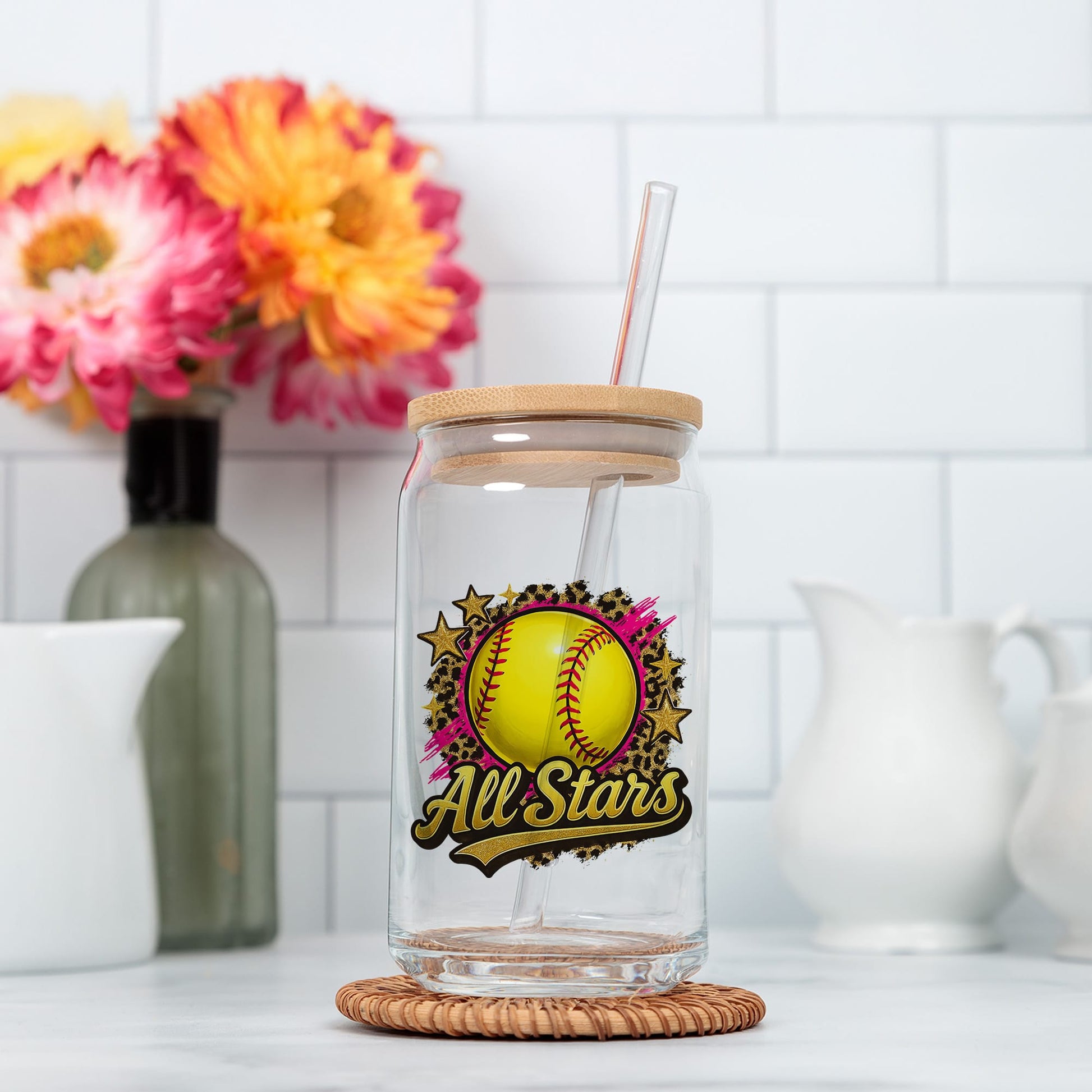 a glass jar with a straw in it sitting on a counter