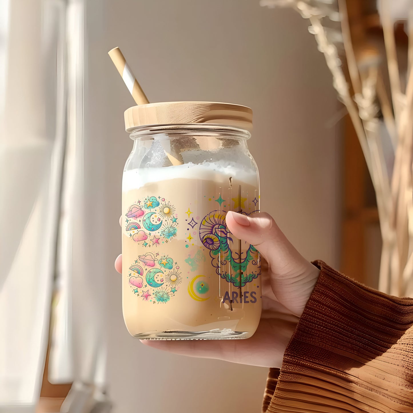 a person holding a jar with a straw in it