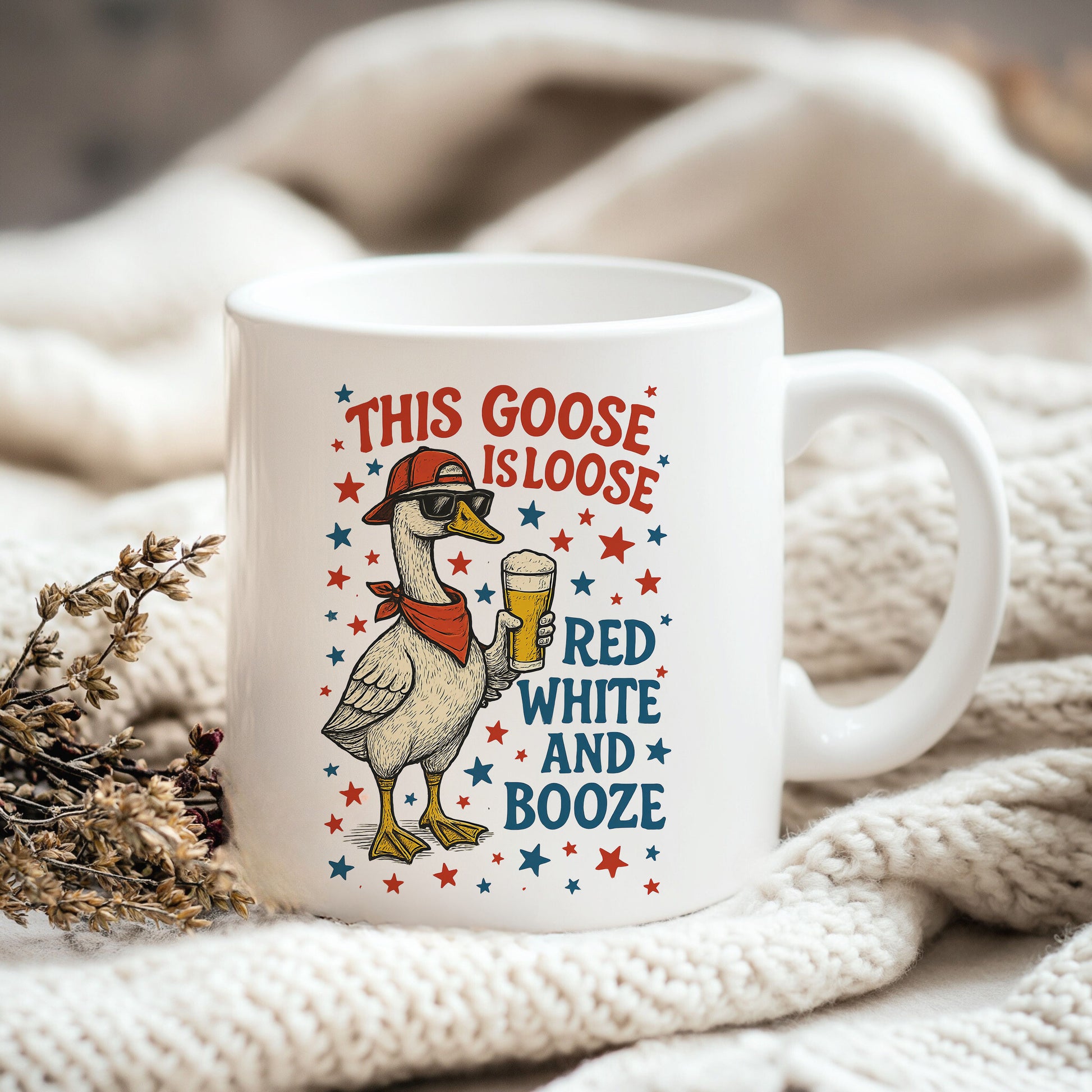 a white coffee mug with a goose on it