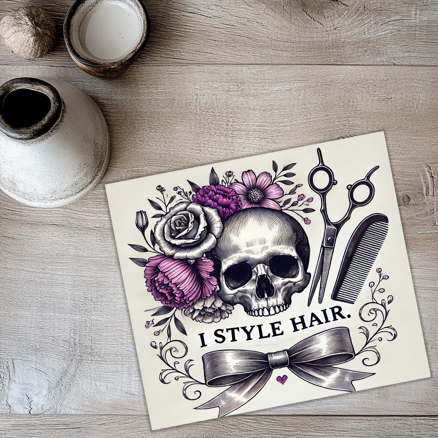 a card with a skull and flowers on it