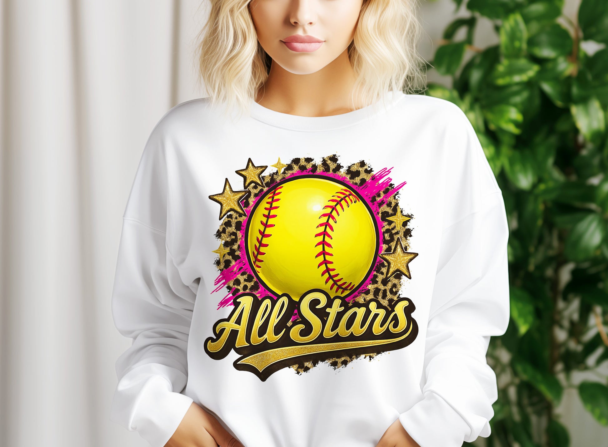 a woman wearing a sweatshirt with a softball on it