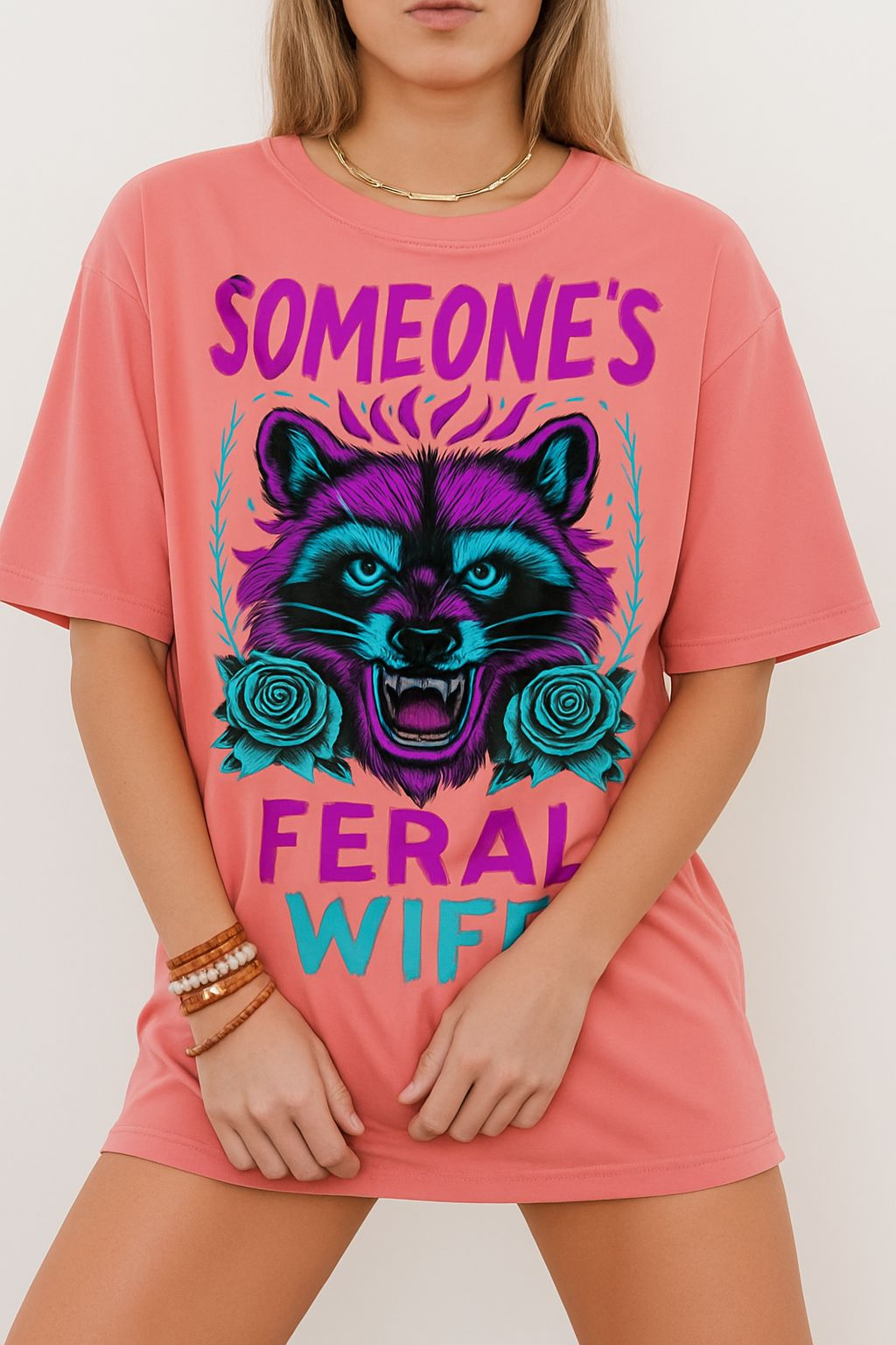 a woman wearing a pink shirt with a raccoon on it