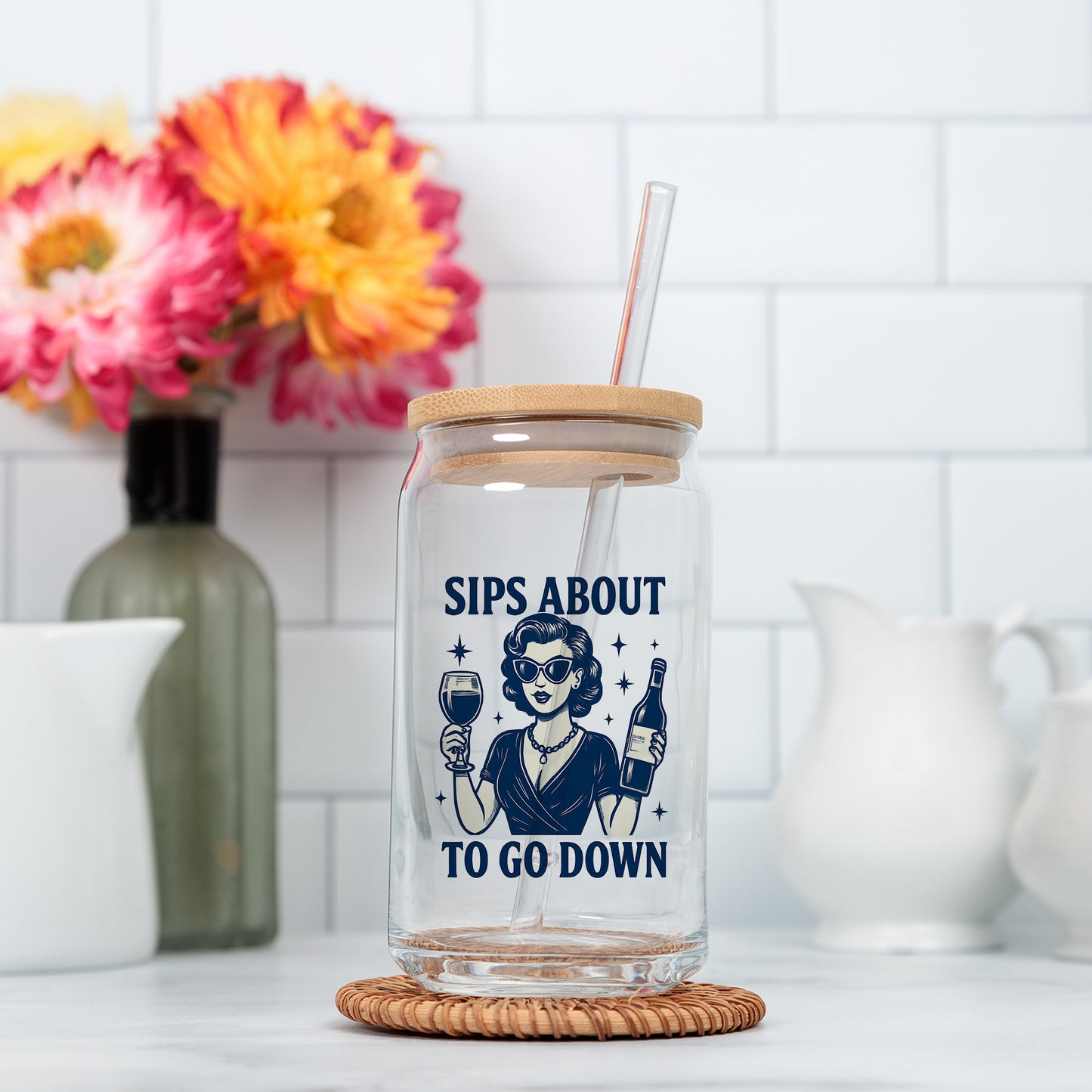 a glass jar with a straw in it sitting on a counter