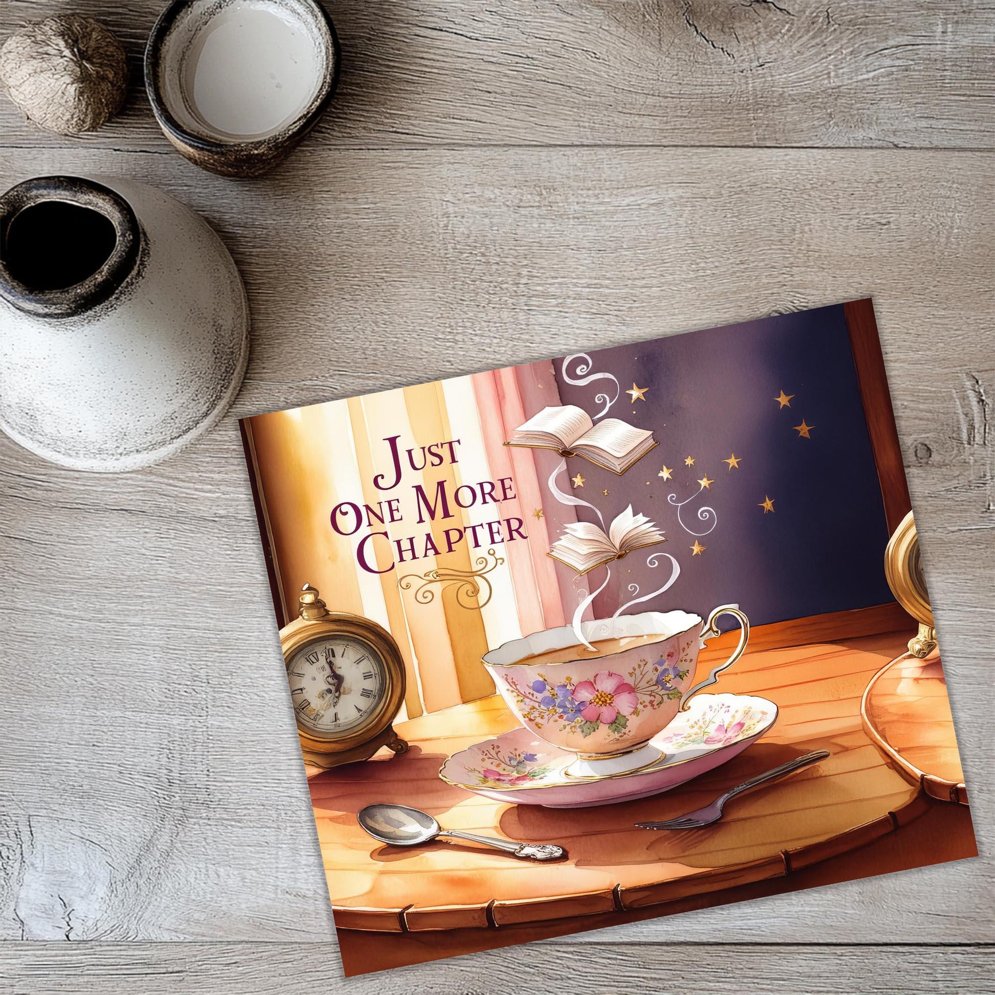 a card with a picture of a teacup on a table