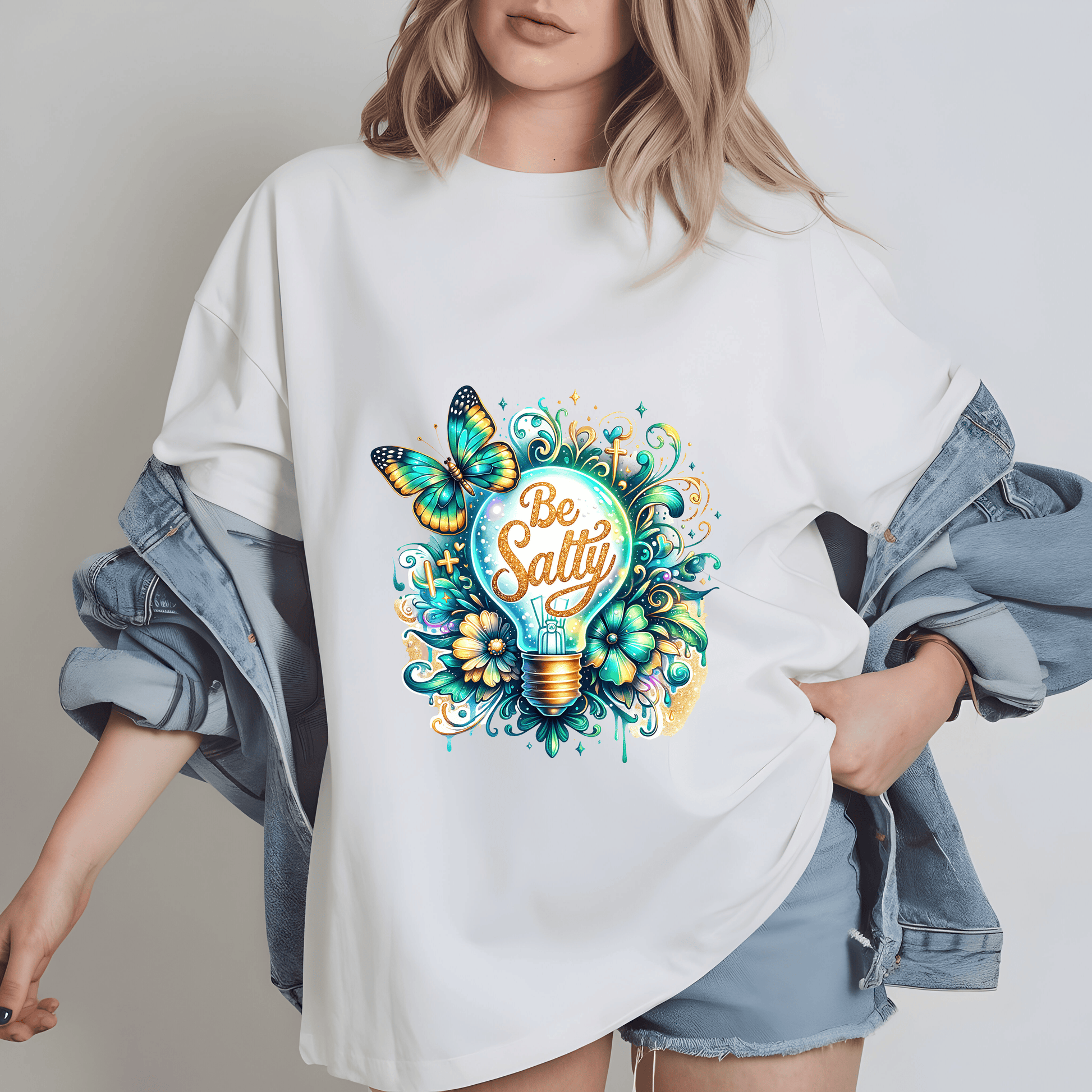a woman wearing a white t - shirt with a light bulb and butterflies on it