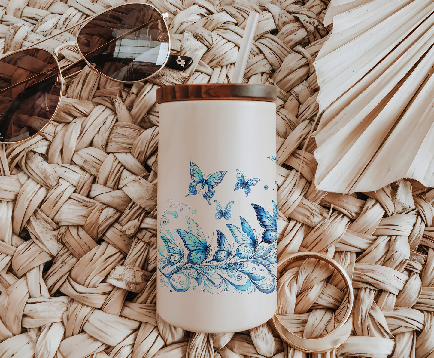 a white coffee mug with blue butterflies on it
