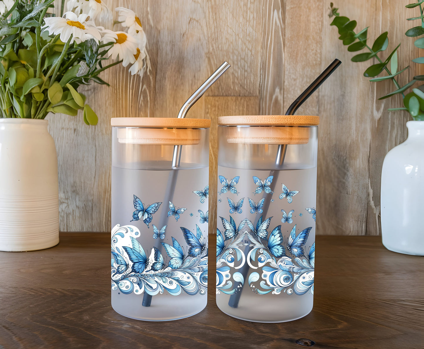 a couple of cups sitting on top of a wooden table