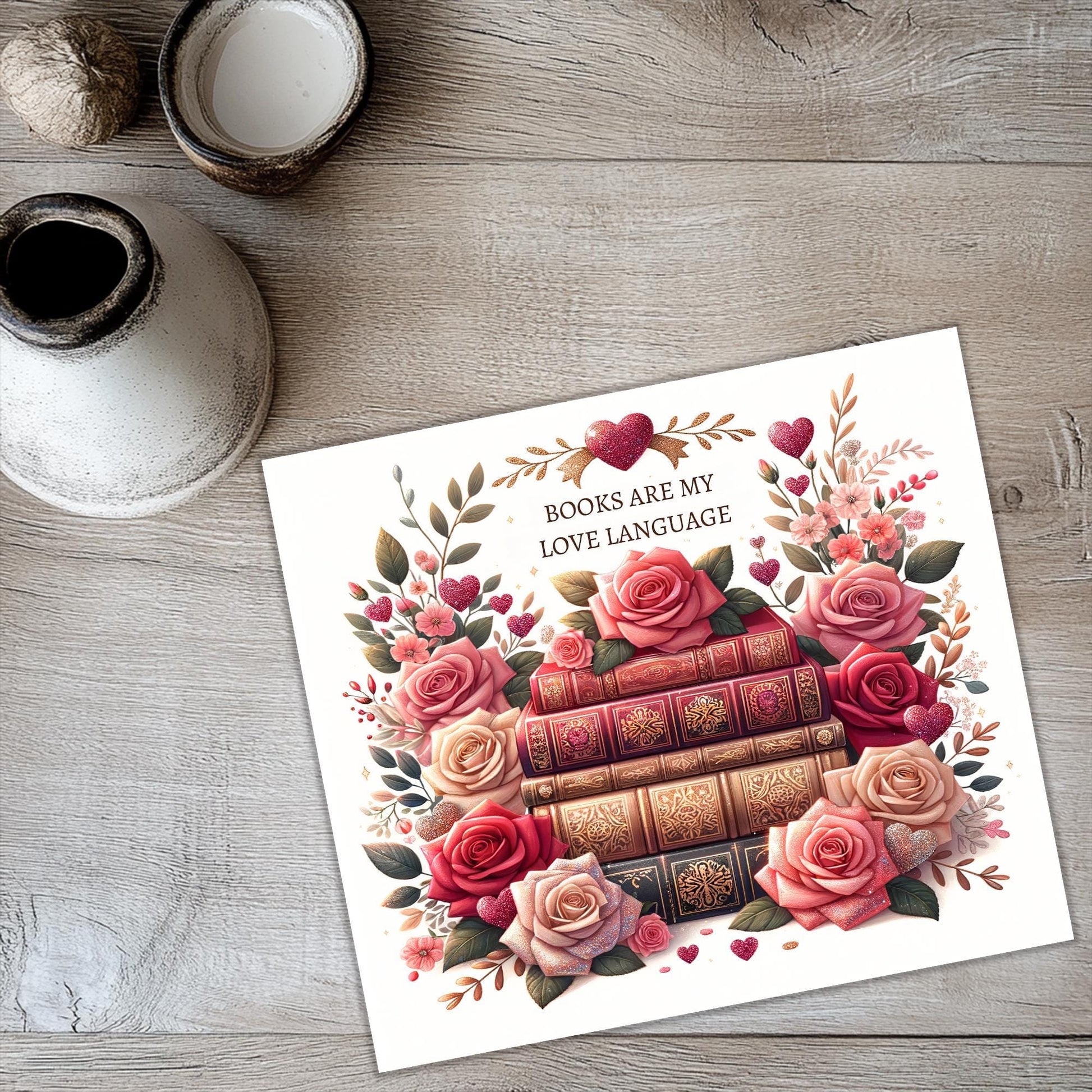 a card with a picture of a stack of books and roses