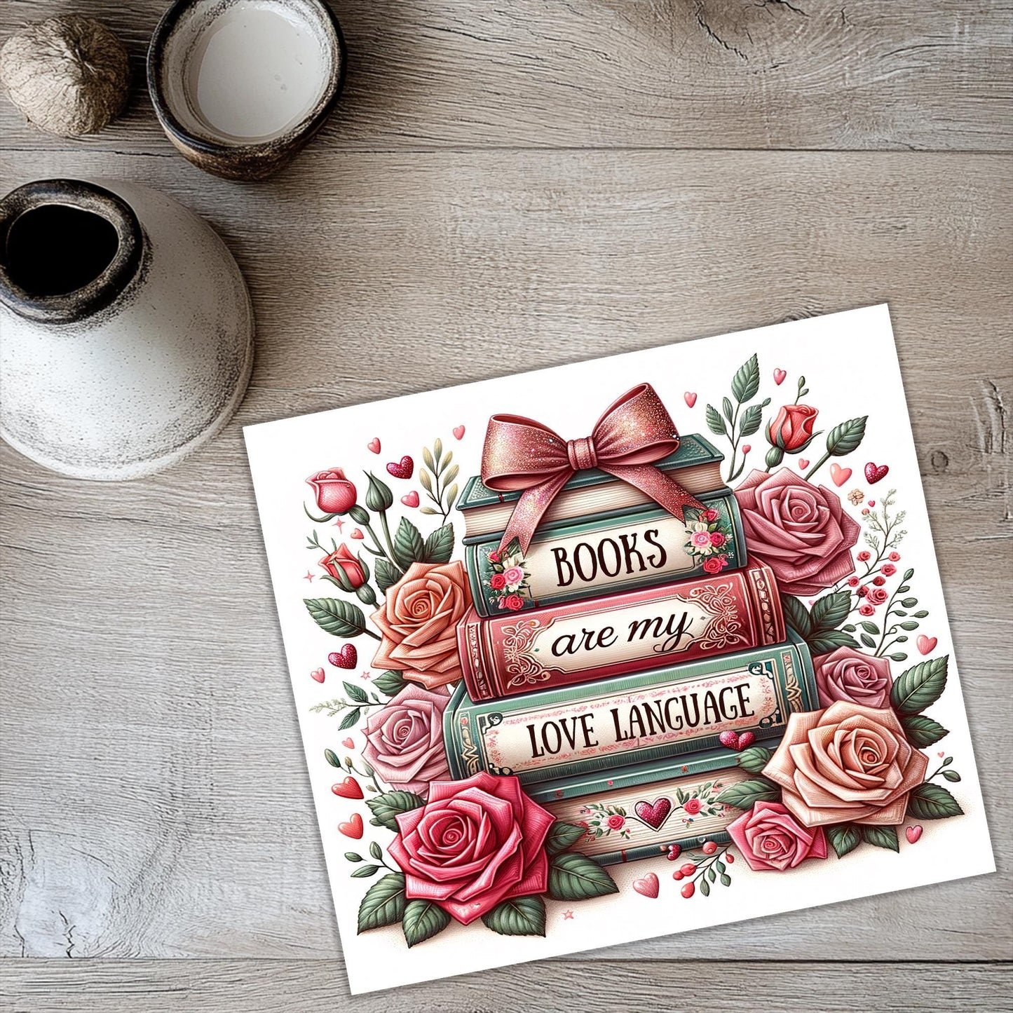 a card with roses and a bow on it