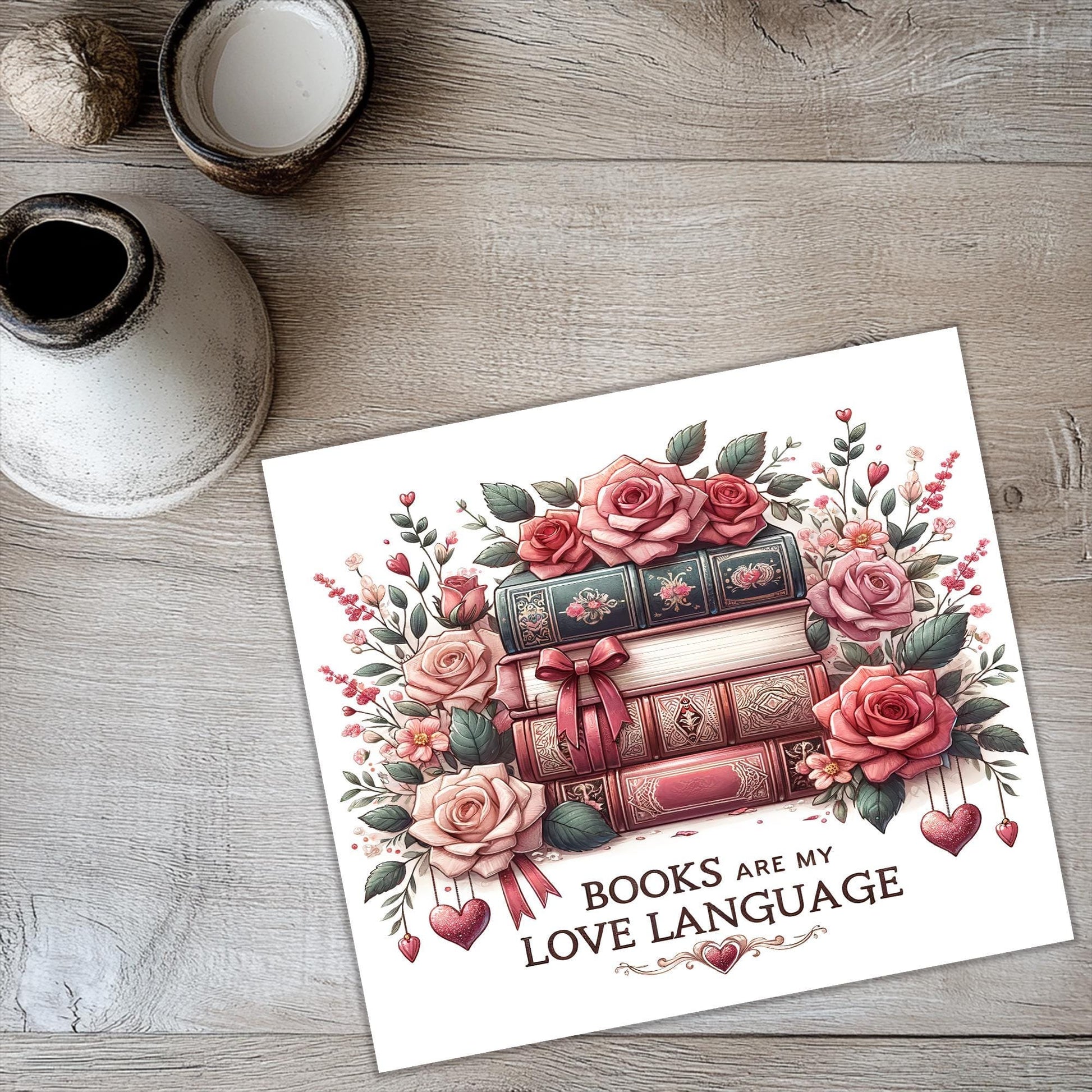 a card with a picture of a stack of books and roses