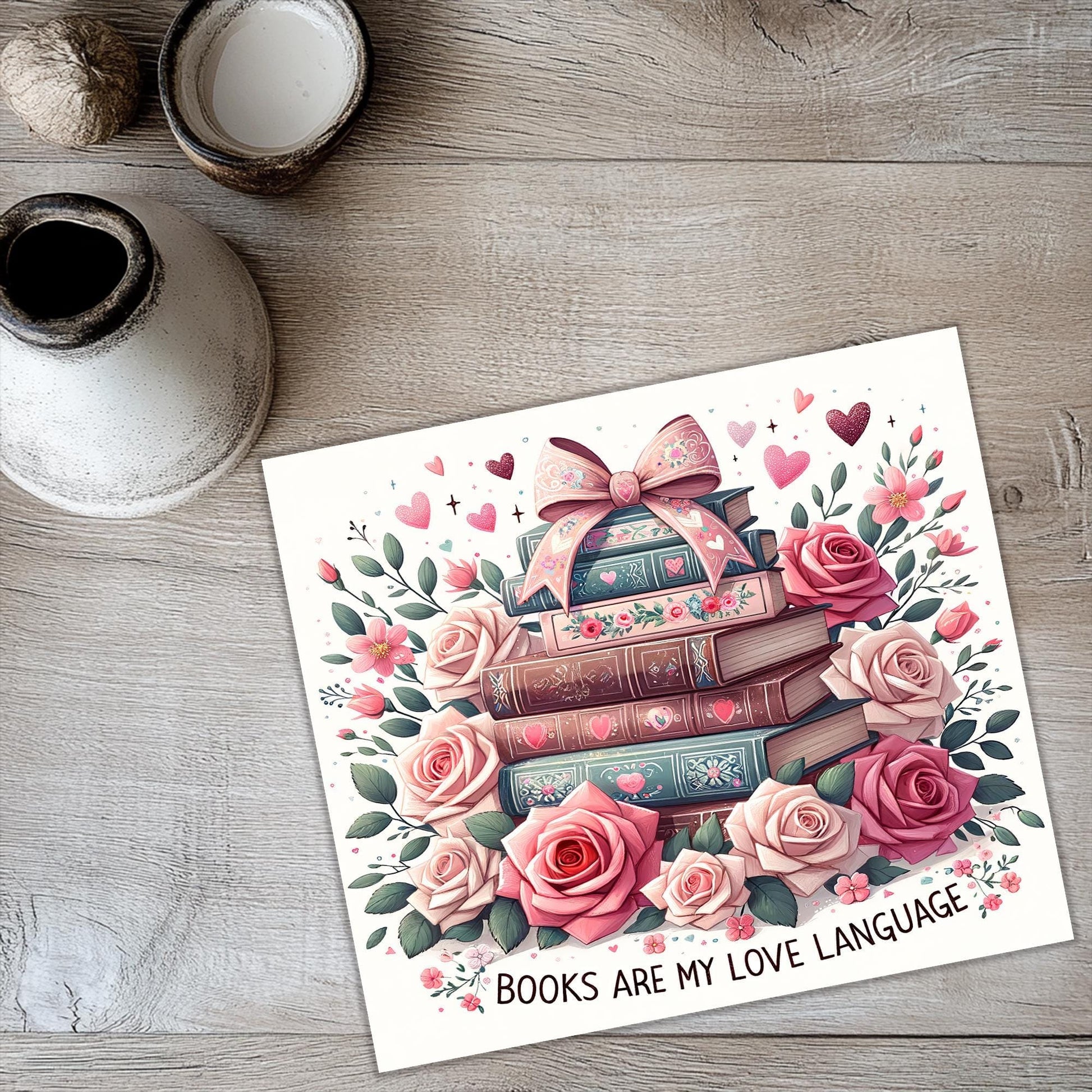 a card with a picture of a stack of books and roses