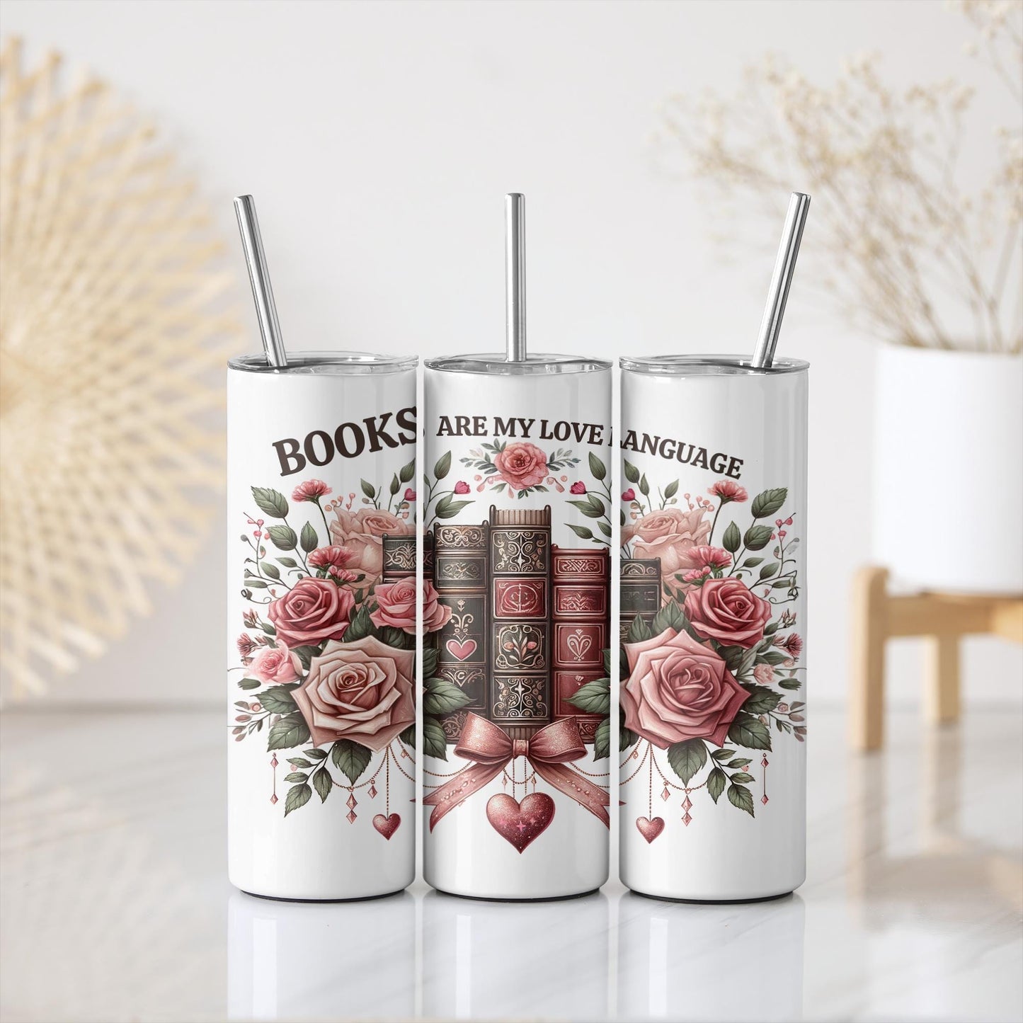 three books are in a row with roses on them