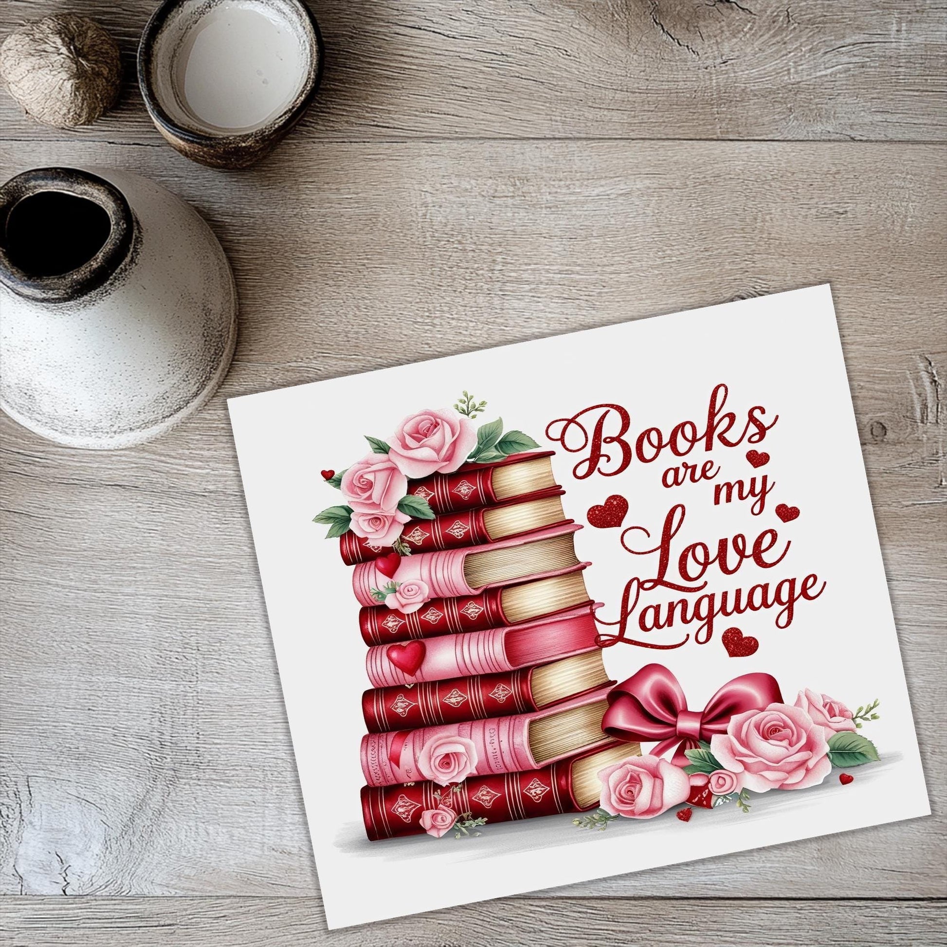a card with a stack of books and roses