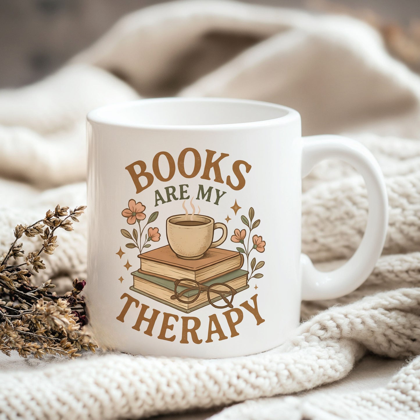 a coffee mug with books are my therapy on it