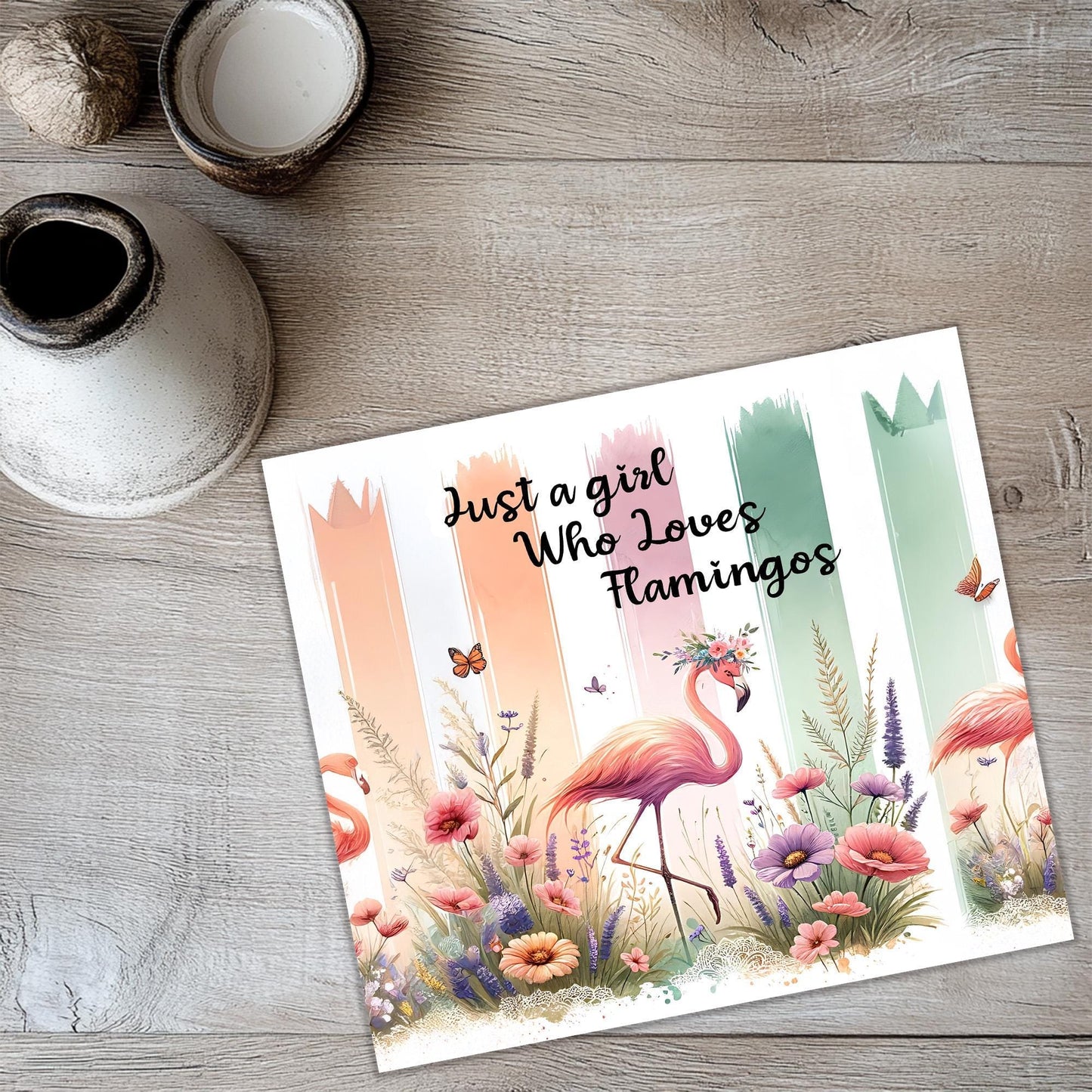 a card with a picture of flamingos and flowers