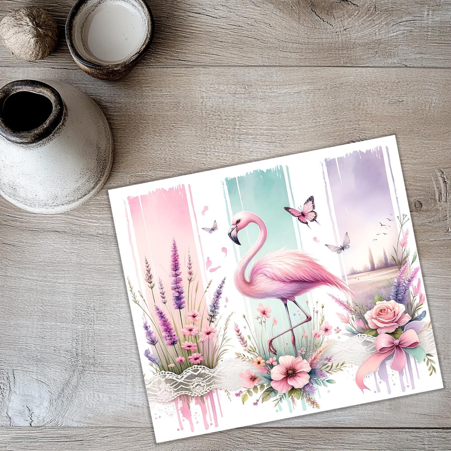 a card with a pink flamingo and flowers