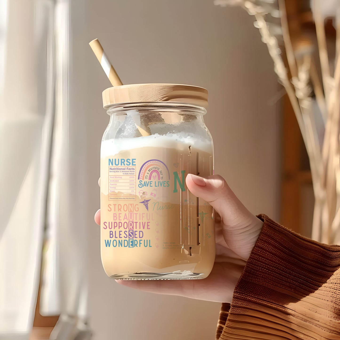 a person holding a jar with a straw in it