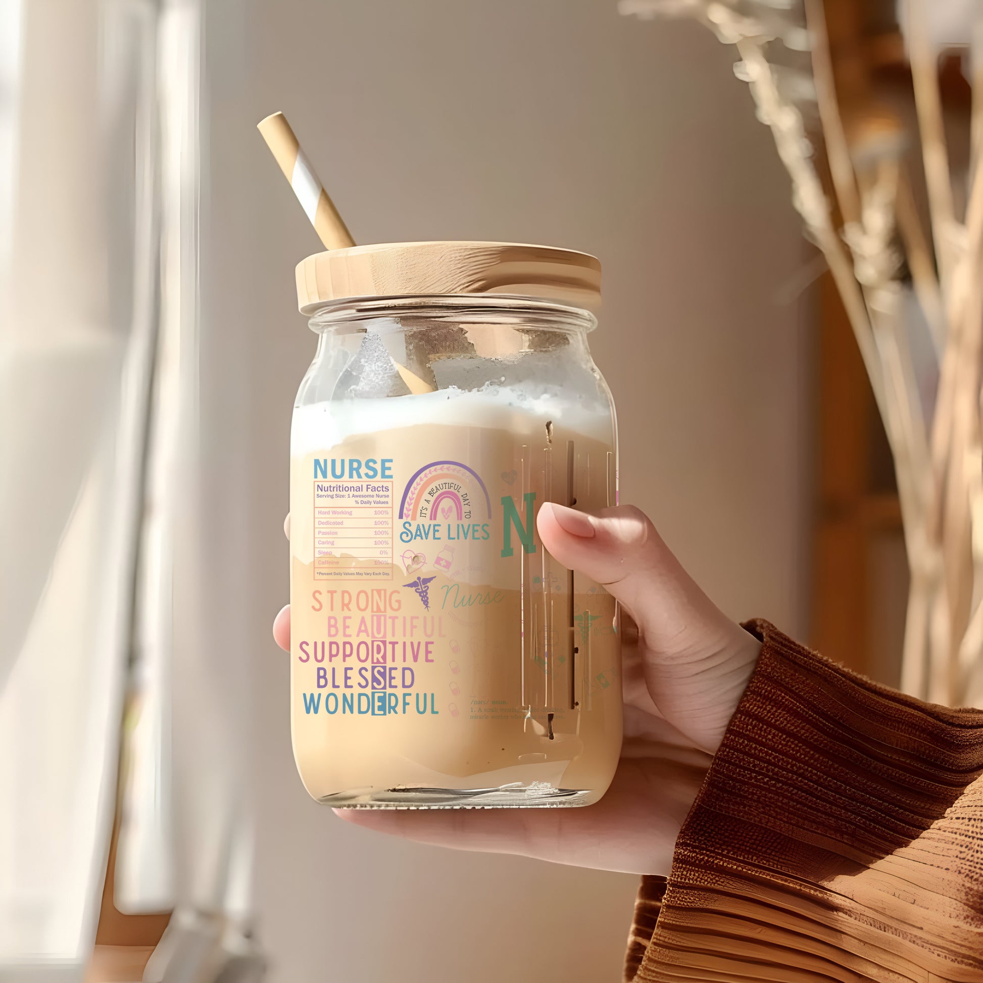 a person holding a jar with a straw in it