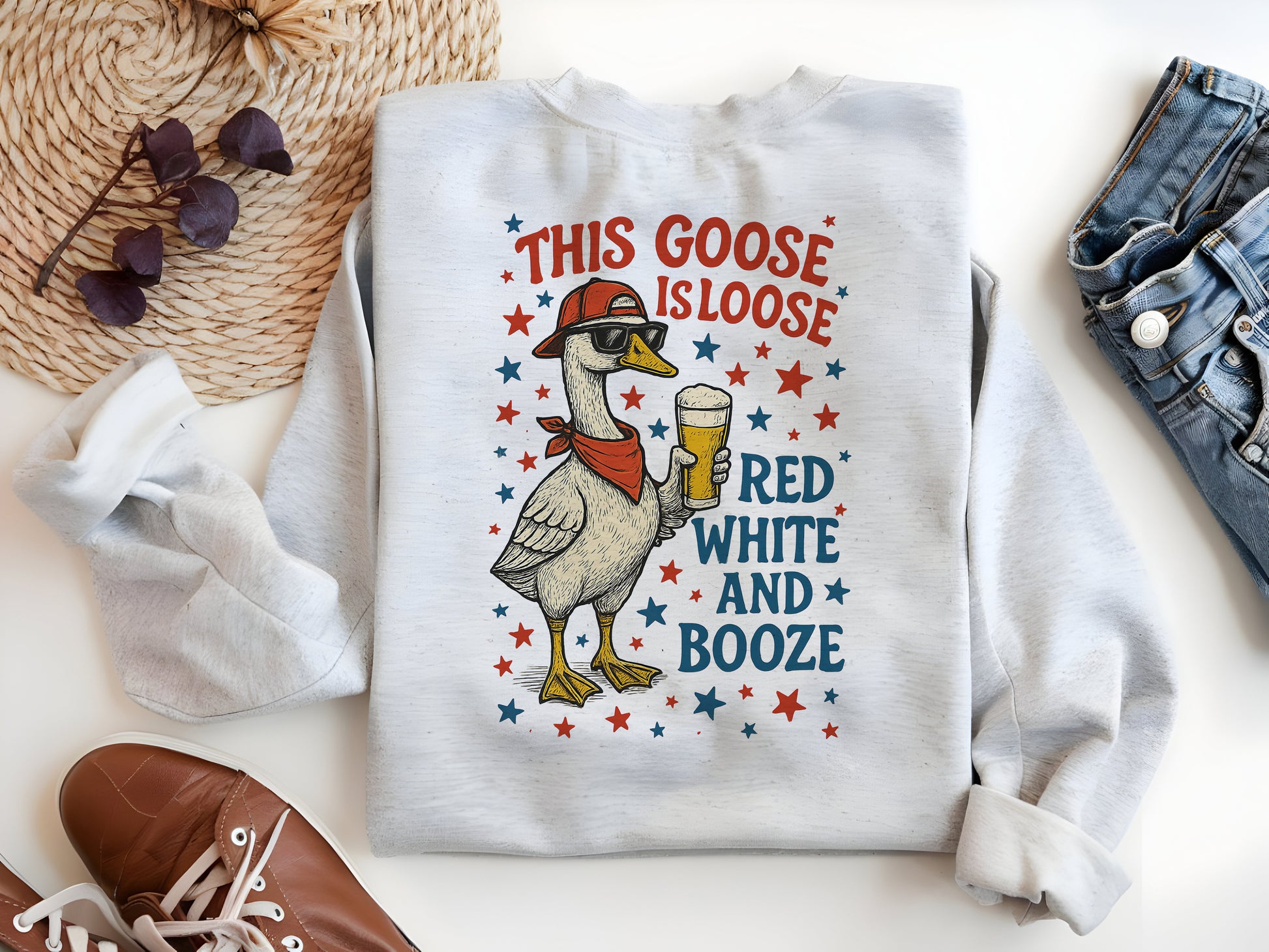 a white shirt with a goose wearing a hat and holding a glass of beer