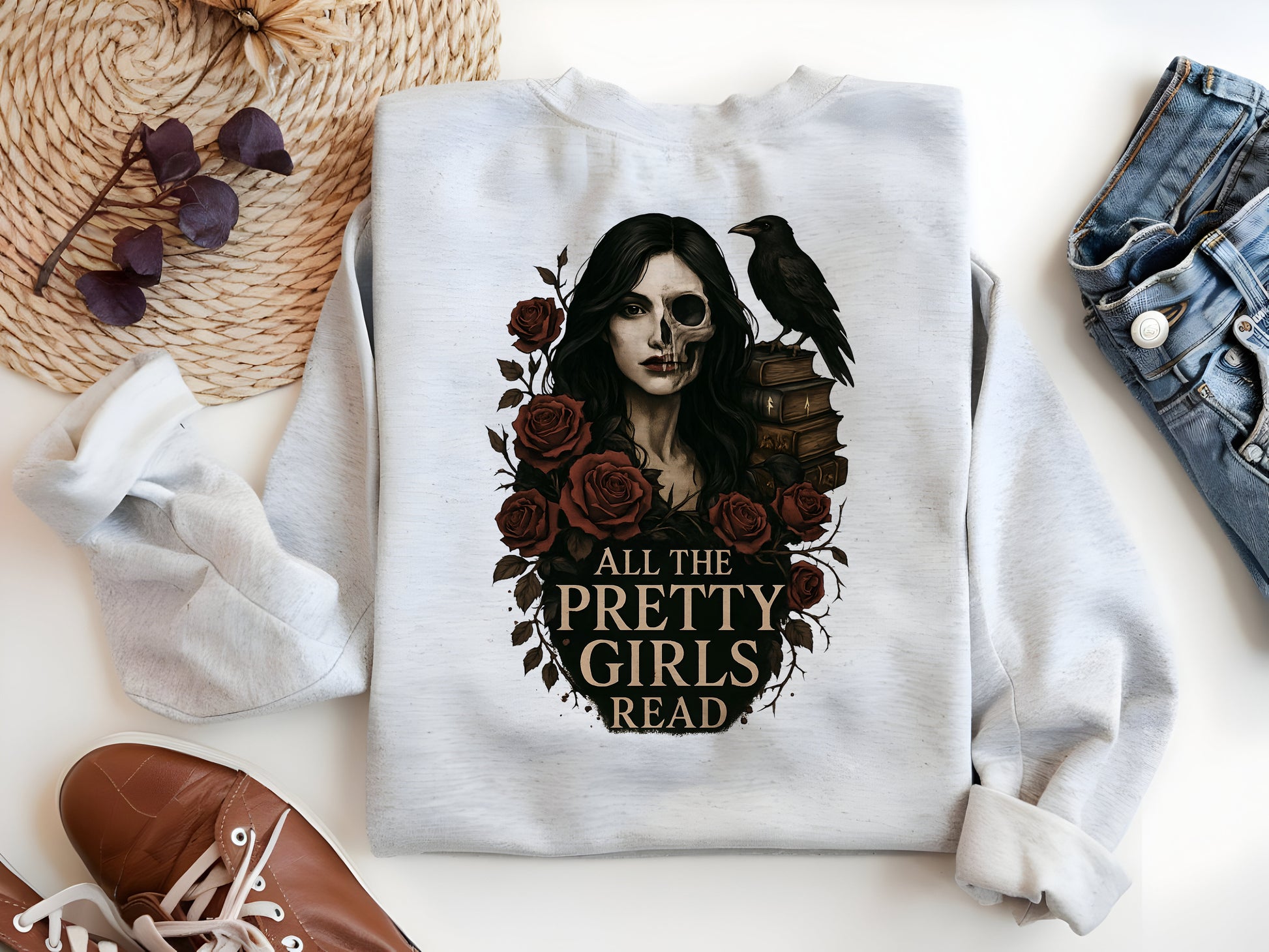 a white shirt with a picture of a woman with a crow on it