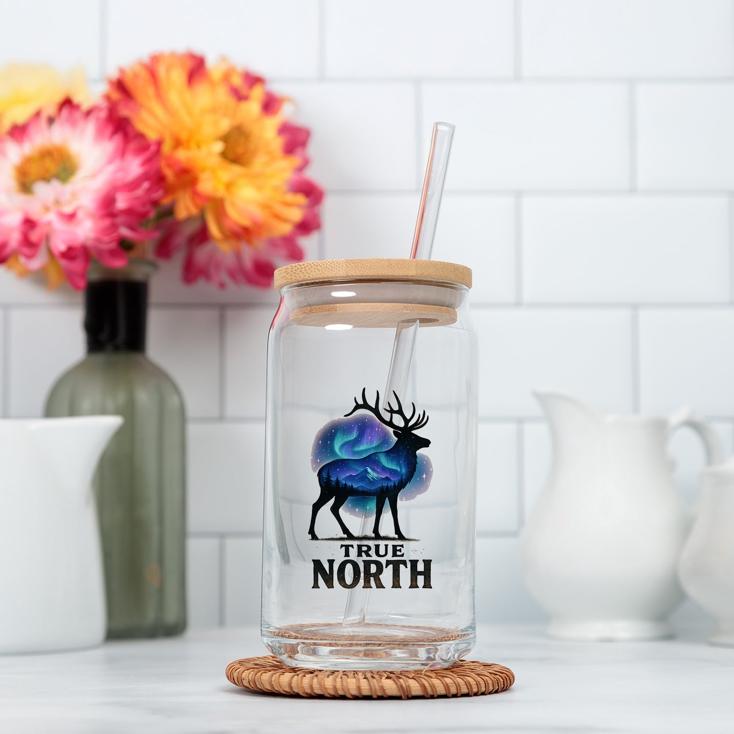 a glass jar with a straw in it sitting on a counter