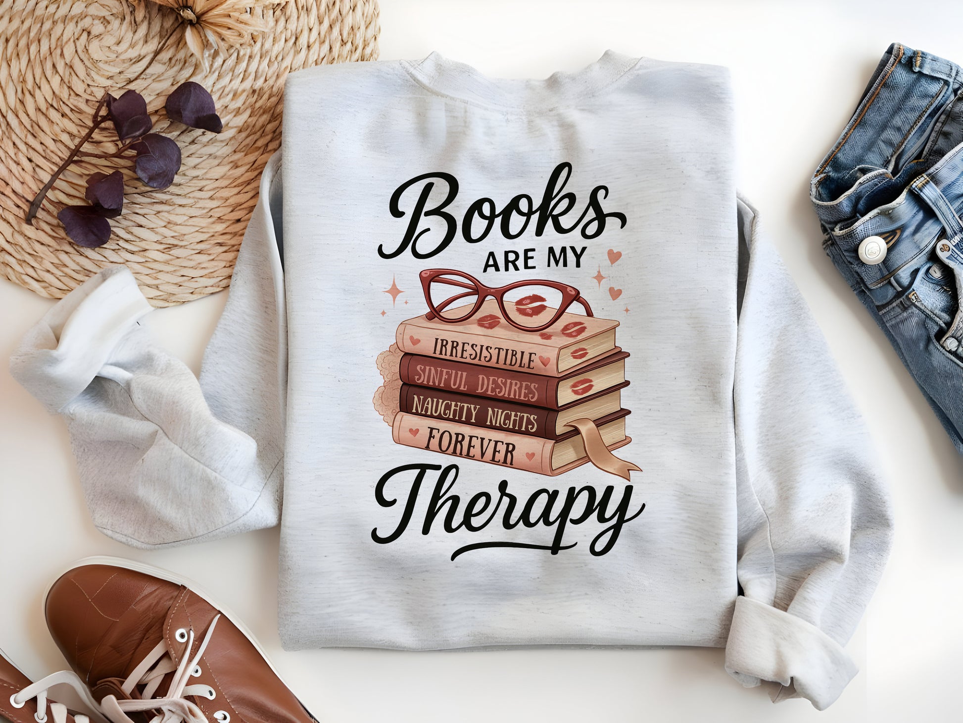 a white shirt with books are my therapy written on it