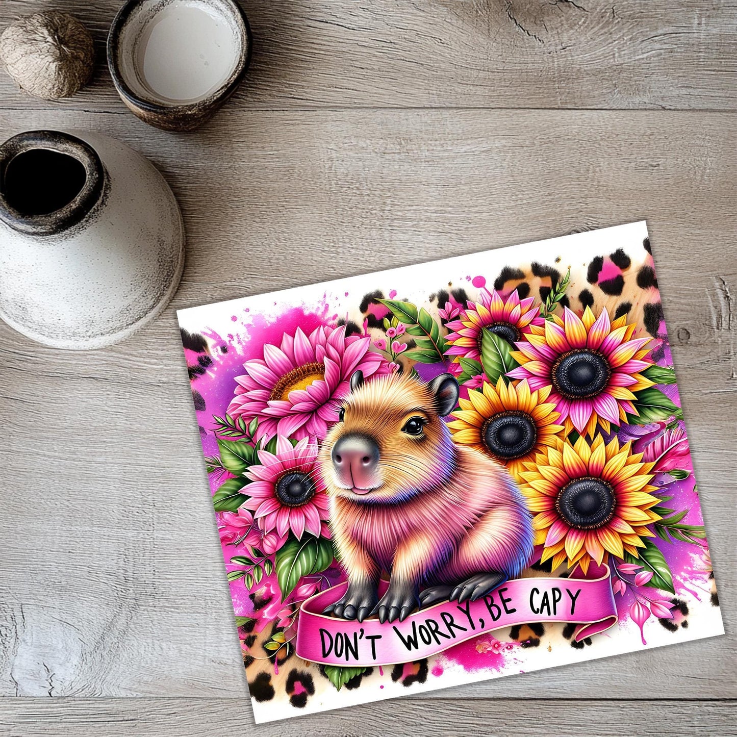 a card with a picture of a koala surrounded by flowers
